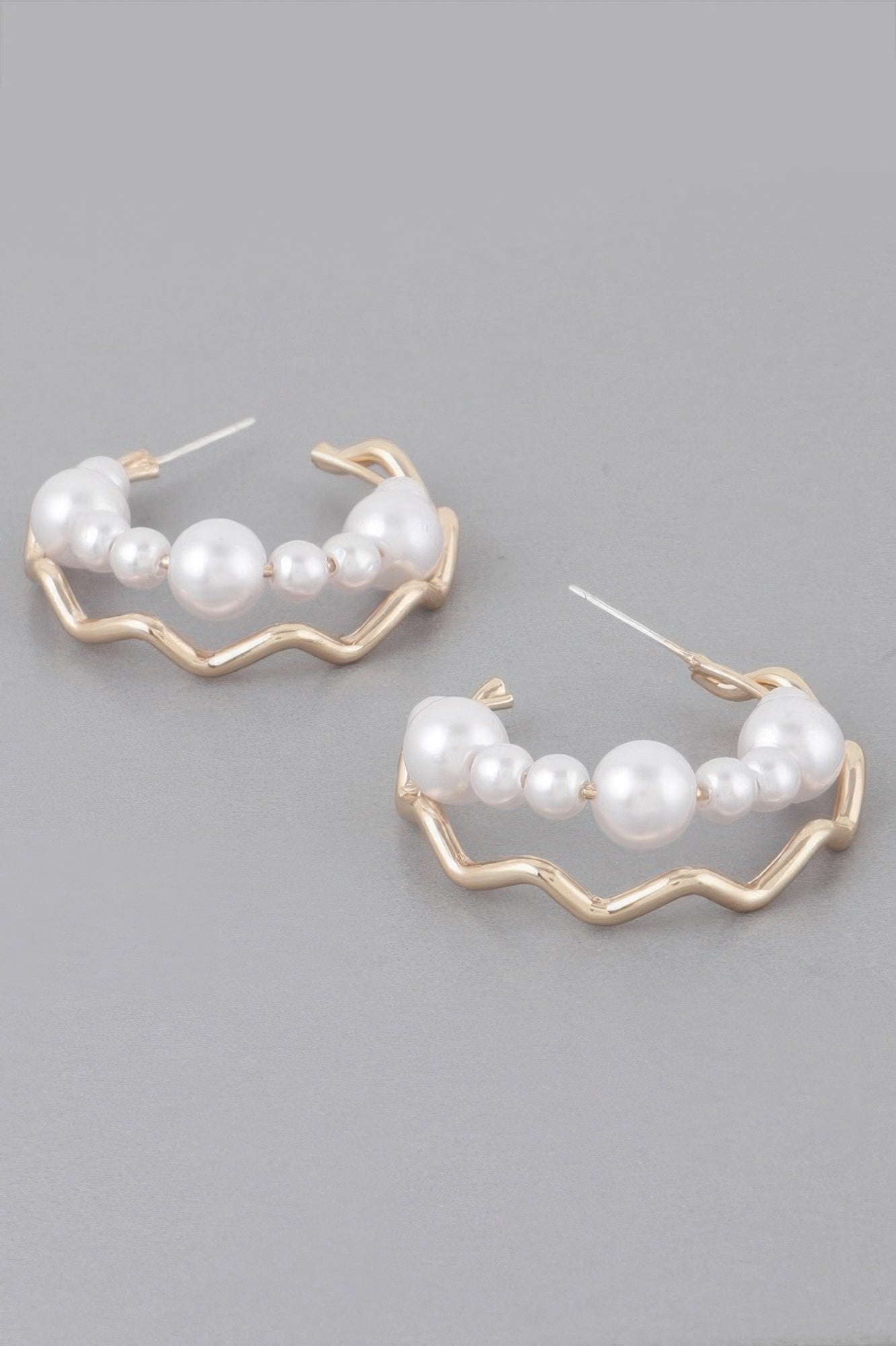 Zigzag faux pearl hoop earrings with gold-cream posts and round faux pearls