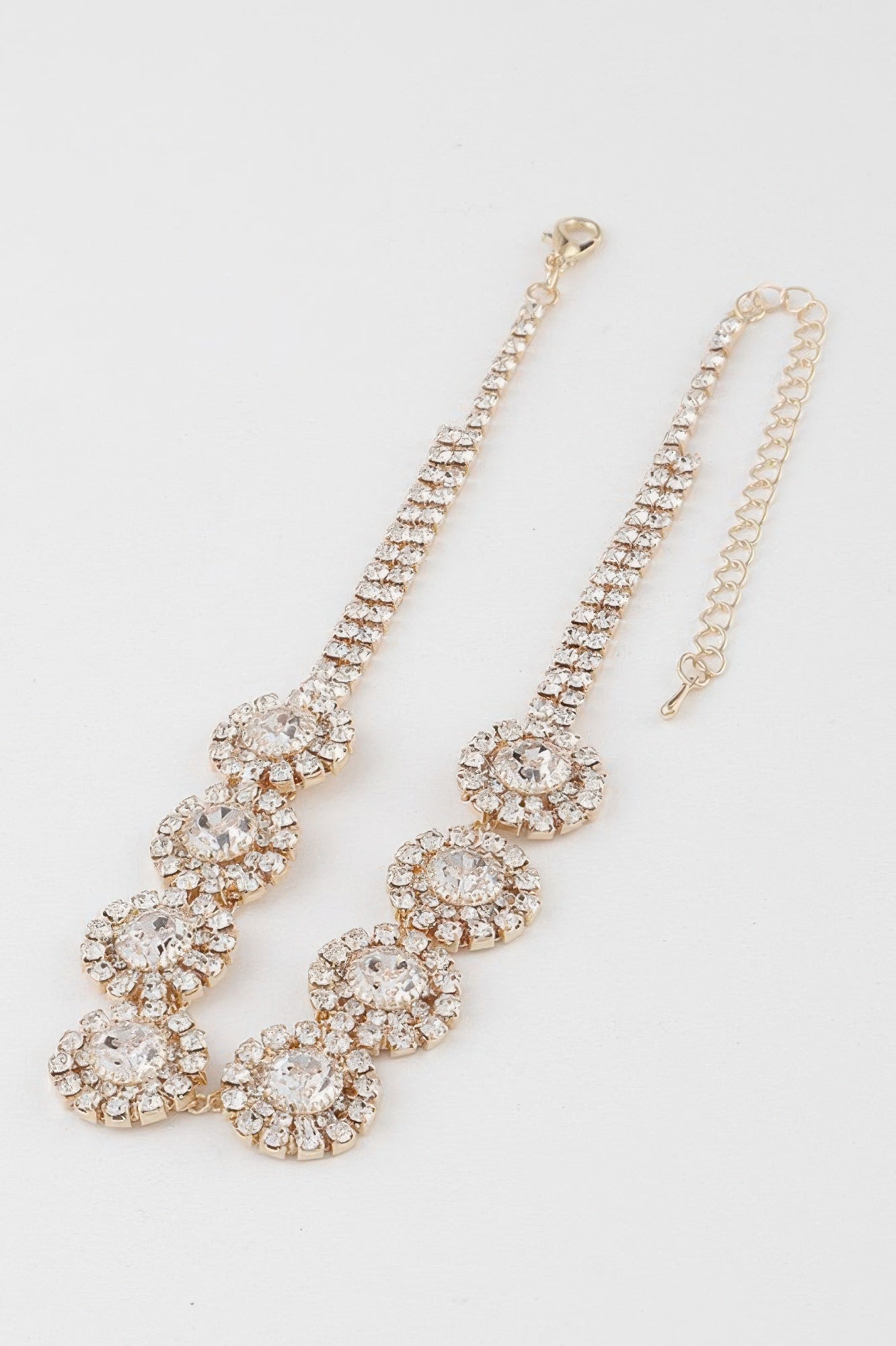 Gold-clear rhinestone choker necklace with linked cluster stones