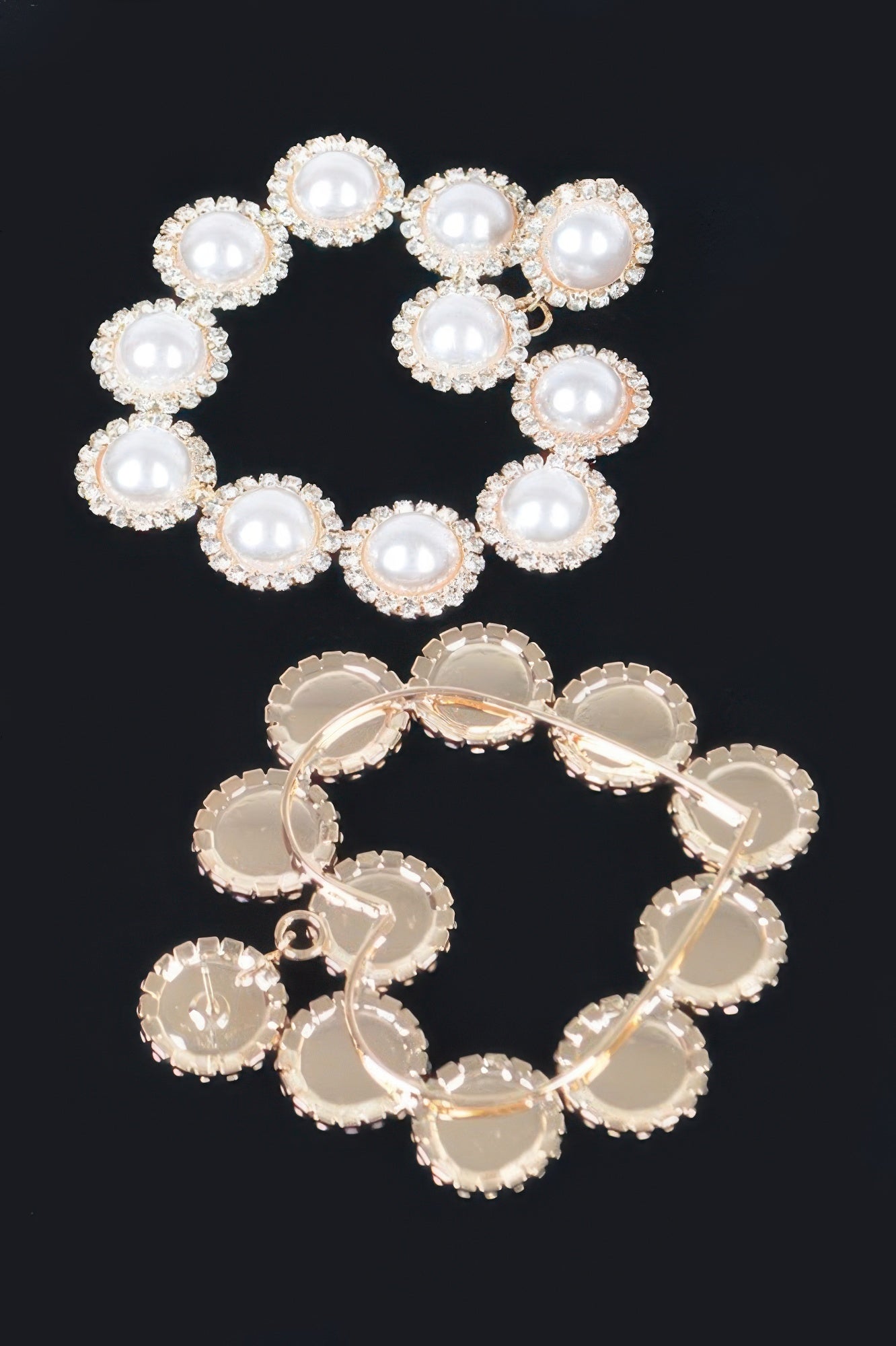 Faux pearl earrings with gold-tone backing and bezel-set round faux pearl centers