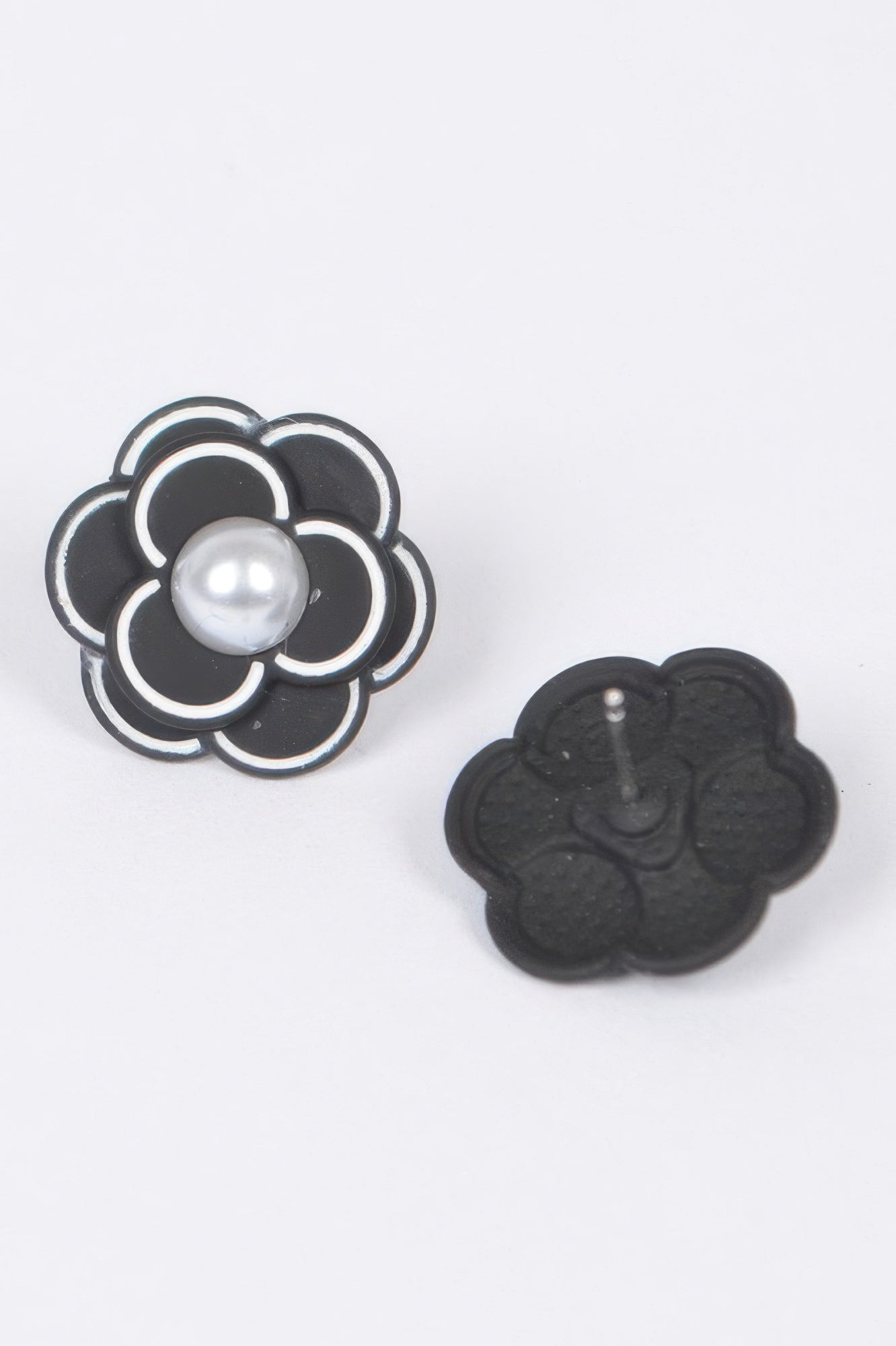 Black faux pearl flower acrylic earrings, textured dark back view