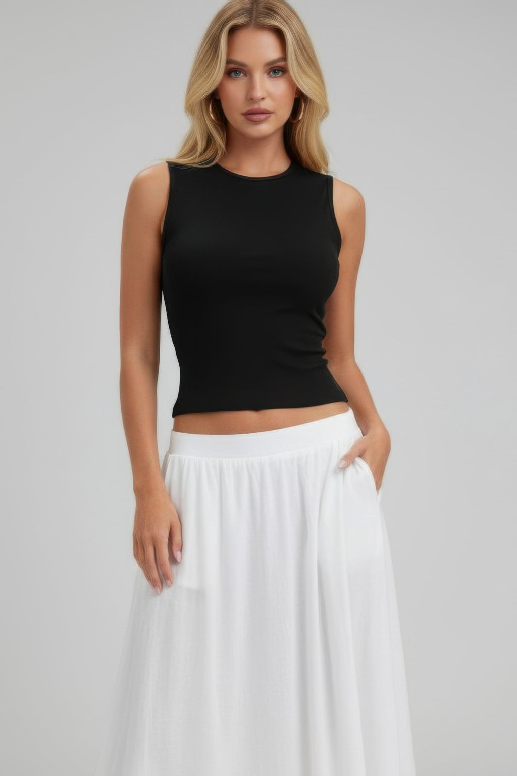 Black sleeveless mock neck top with adjustable side tie, cropped length