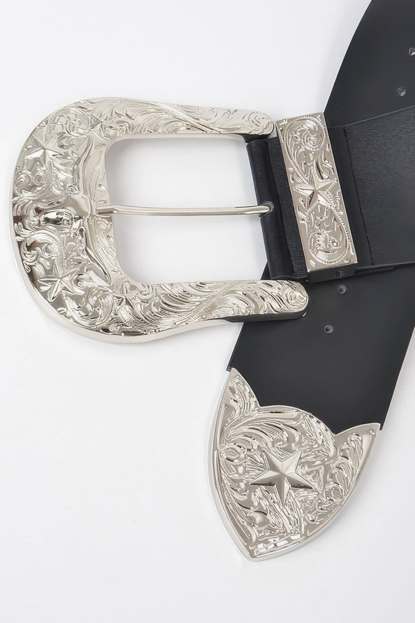 Bulky Buckle Belt close-up—black strap with ornate silver buckle and engraved end plates