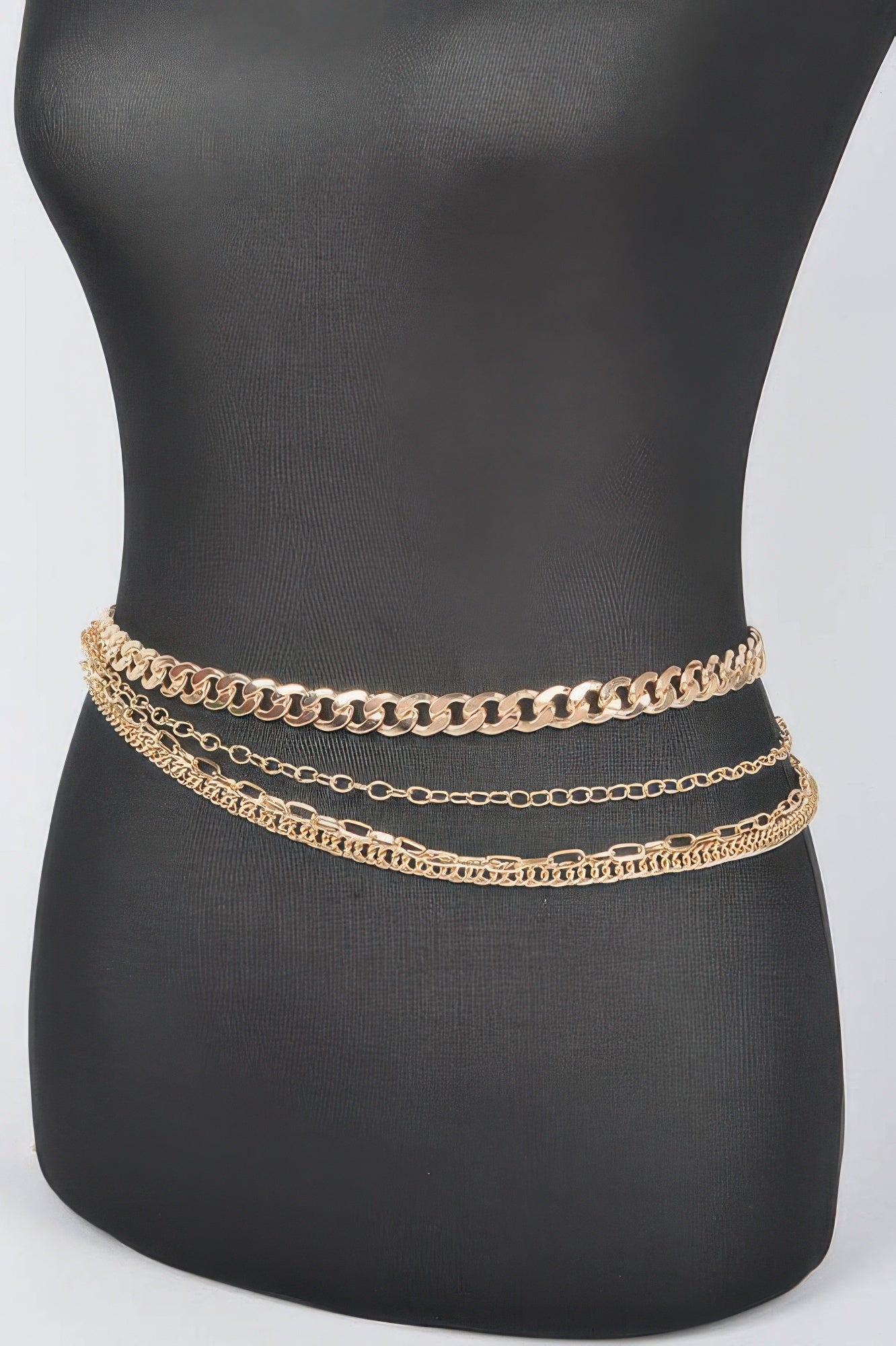 Gold-tone chain belt with three layered rows on mannequin