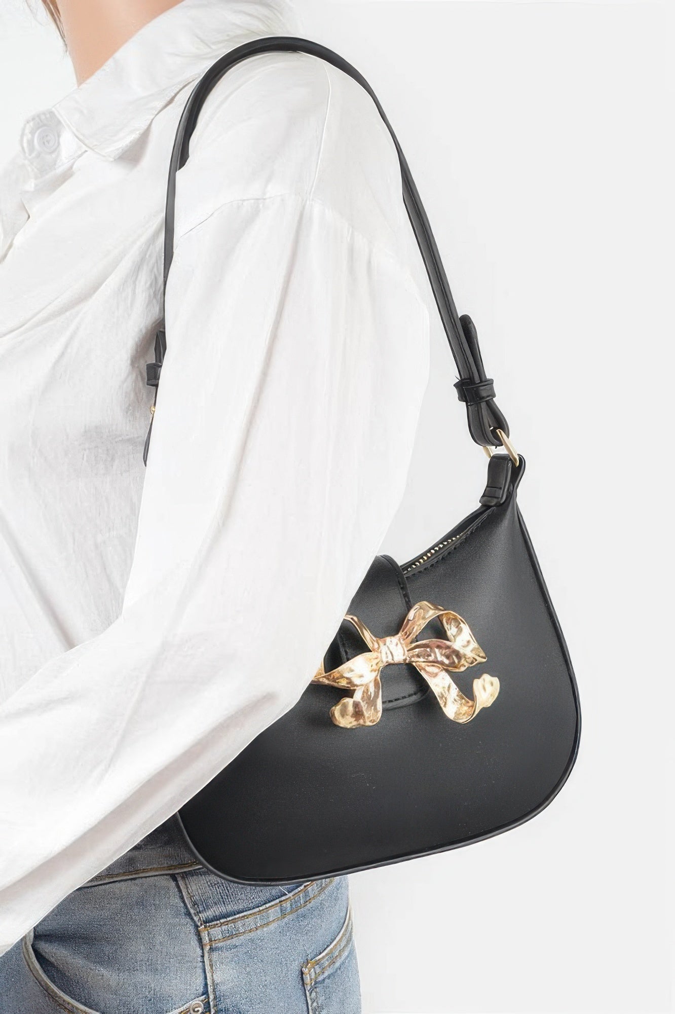Black vegan leather small hobo bag worn look, gold bow ribbon front detail