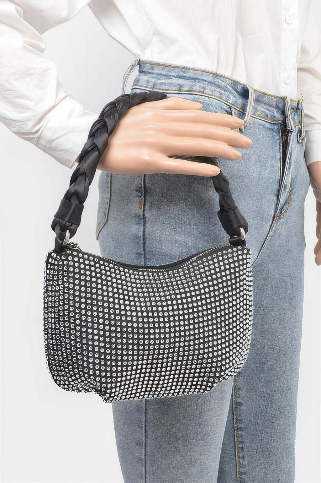 Small hobo bag with silver rhinestone exterior and twisted black braided handles