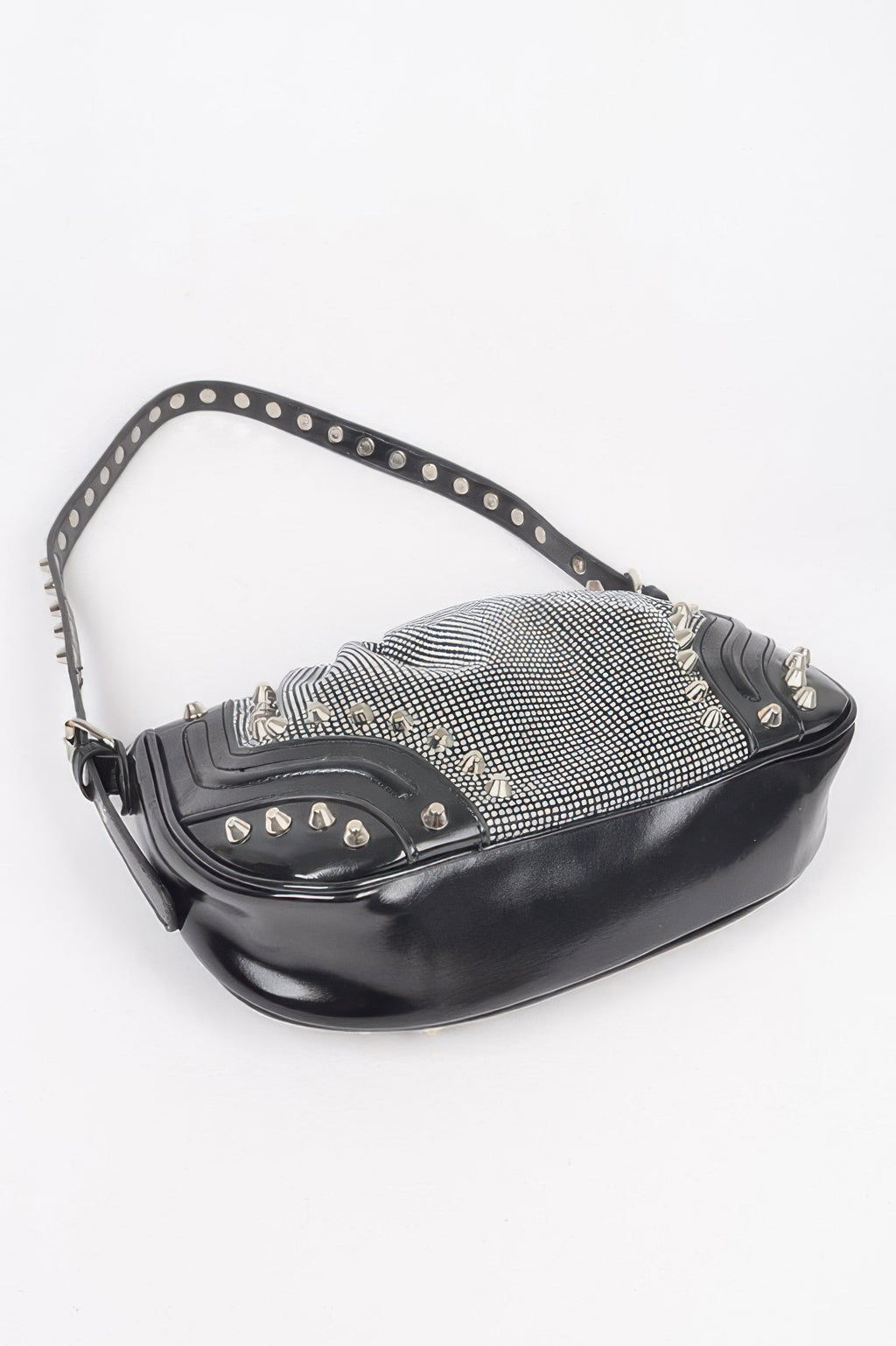 Black crescent shoulder bag with rhinestone mesh panel and metal studs across trim