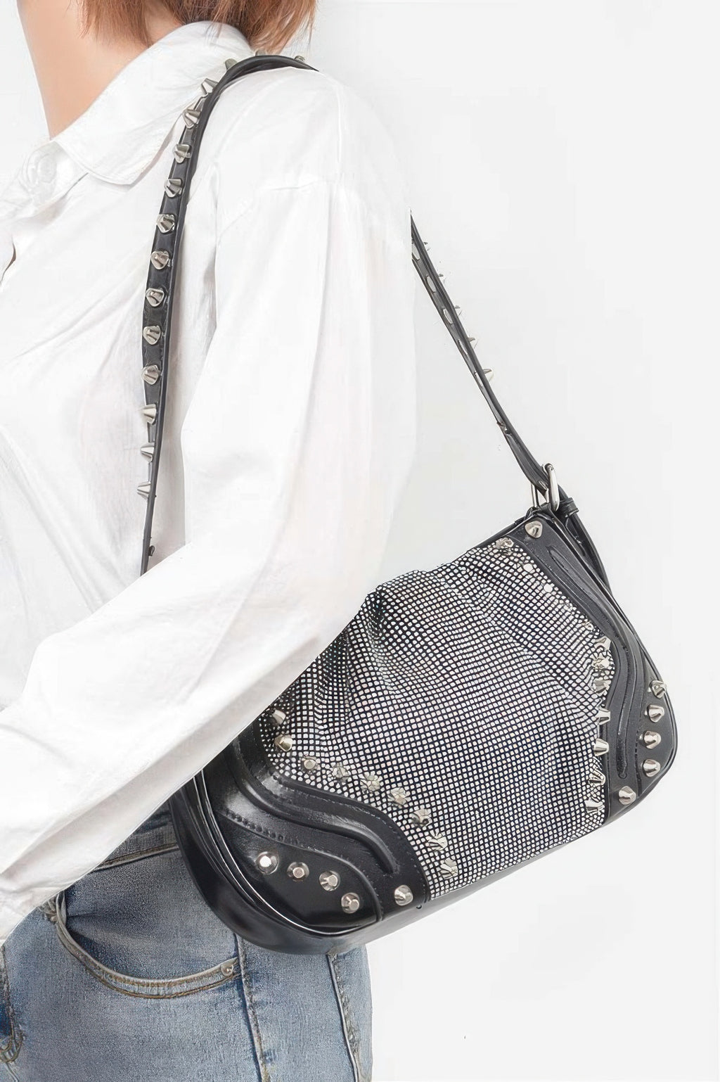 Black rhinestone mesh shoulder bag with studded strap and metal corner studs