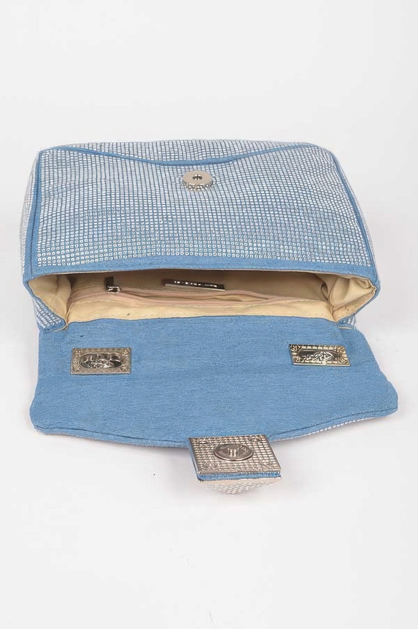 Light blue denim clutch open view with rhinestone flap and interior lining