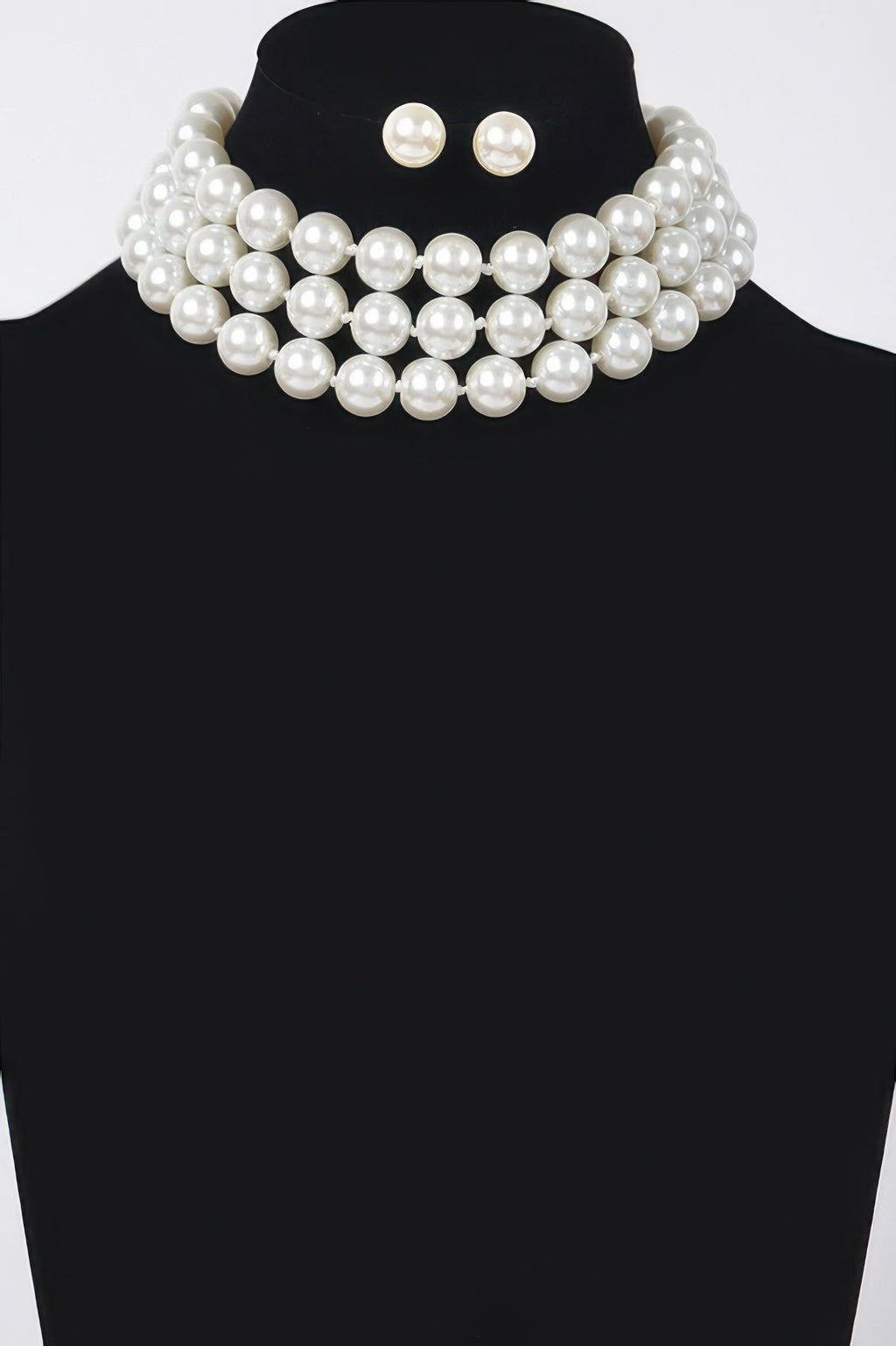 Ivory faux-pearl choker with pearl cluster layers and matching stud earrings