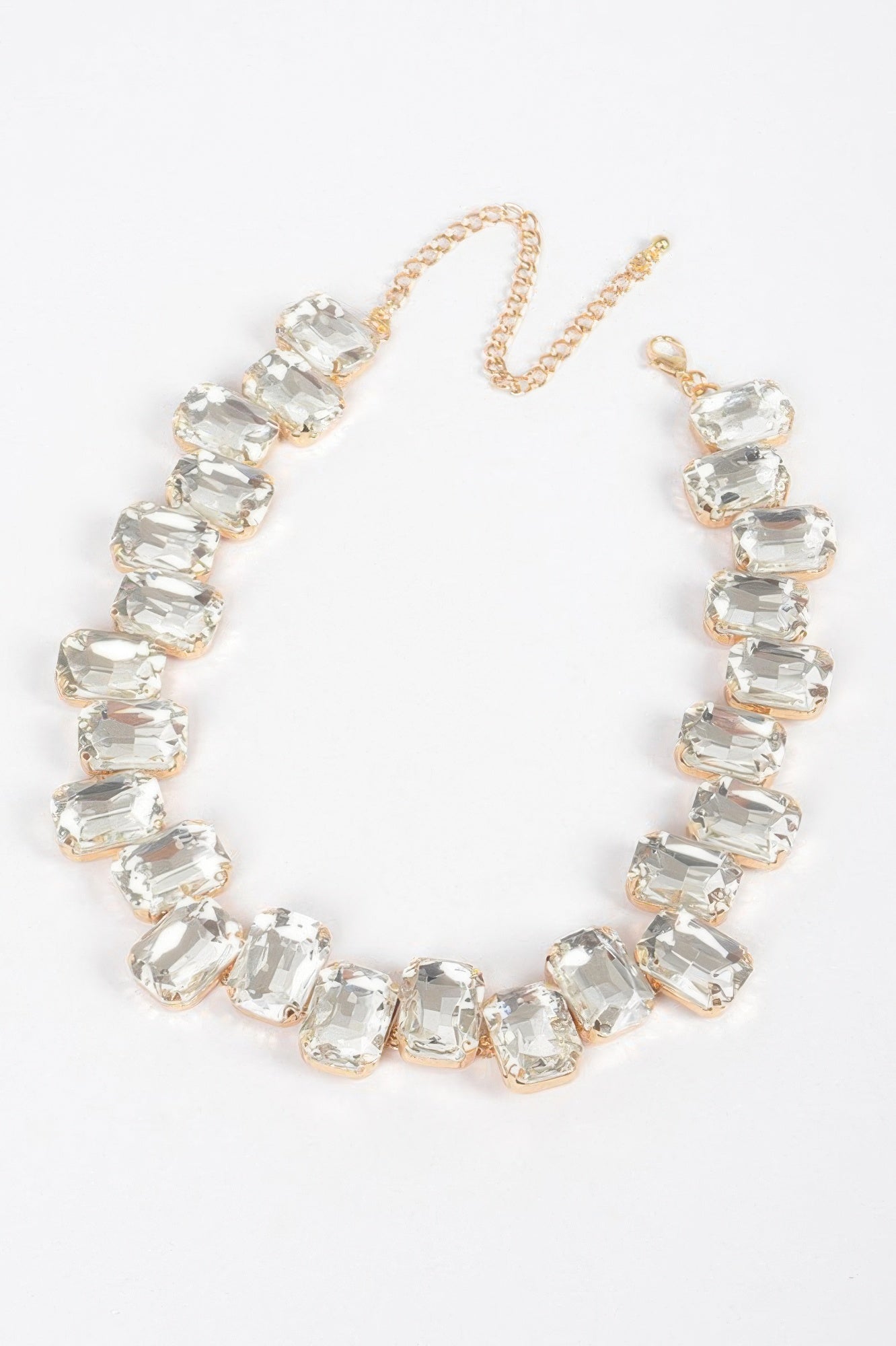 Clear stone bead tennis necklace with gold-tone chain and clasp, flexible links