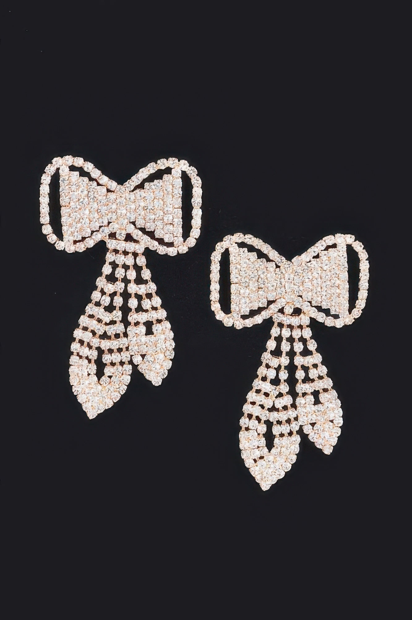 Rhinestone bow earrings with bow-front design and dangling crystal tassels
