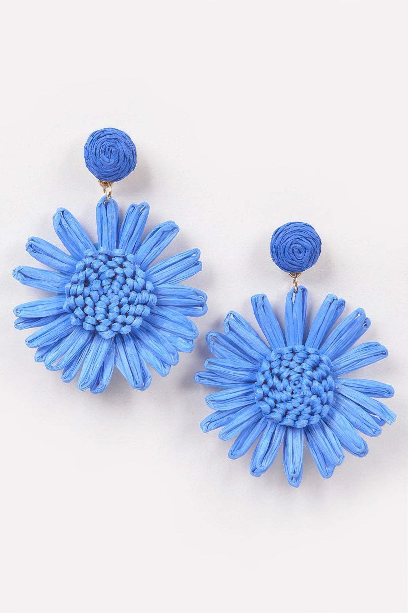Cobalt blue flower earrings with textured round centers and spiky petal fibers