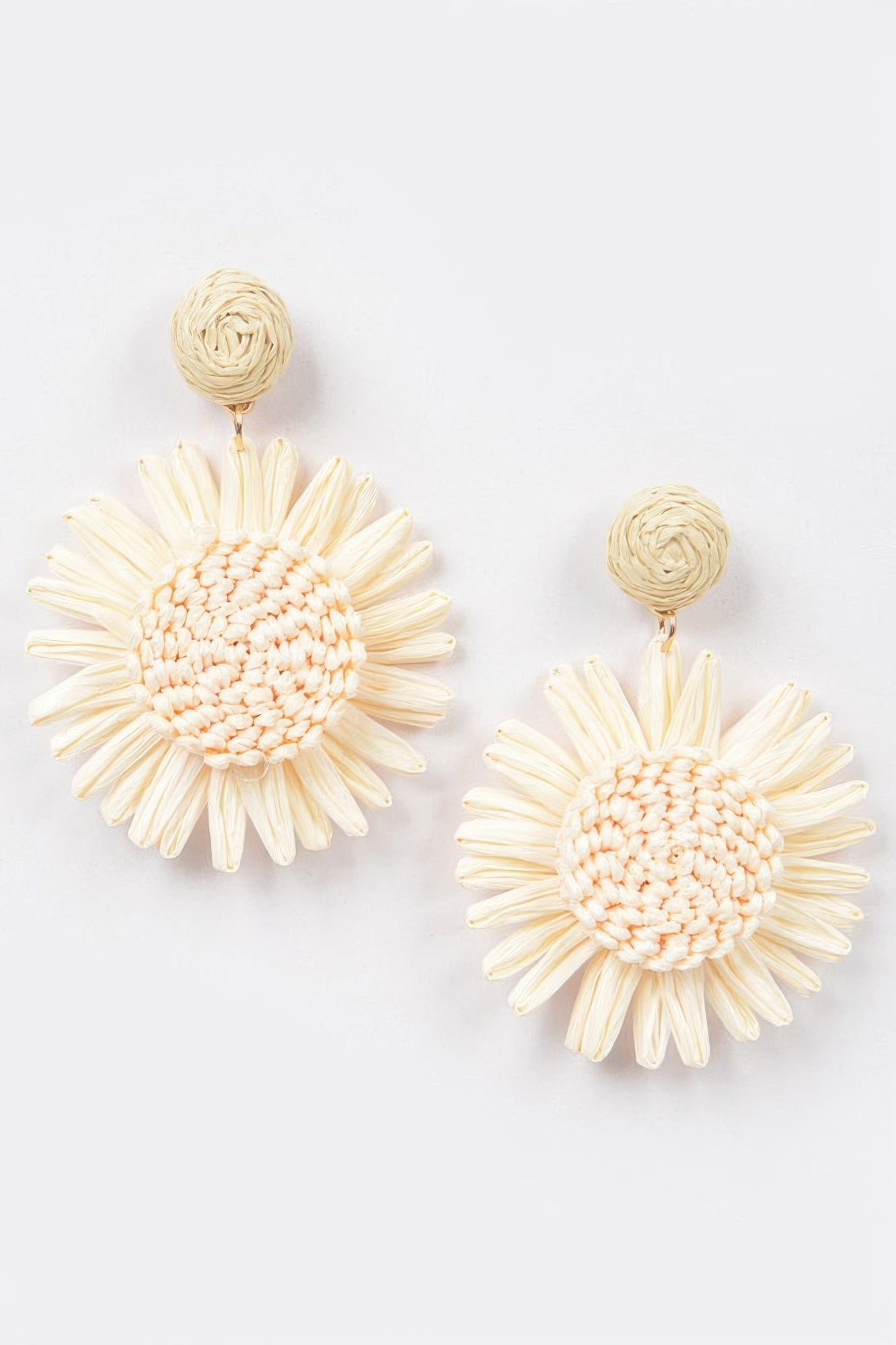 Ivory white flower earrings with woven petals and clustered textured center