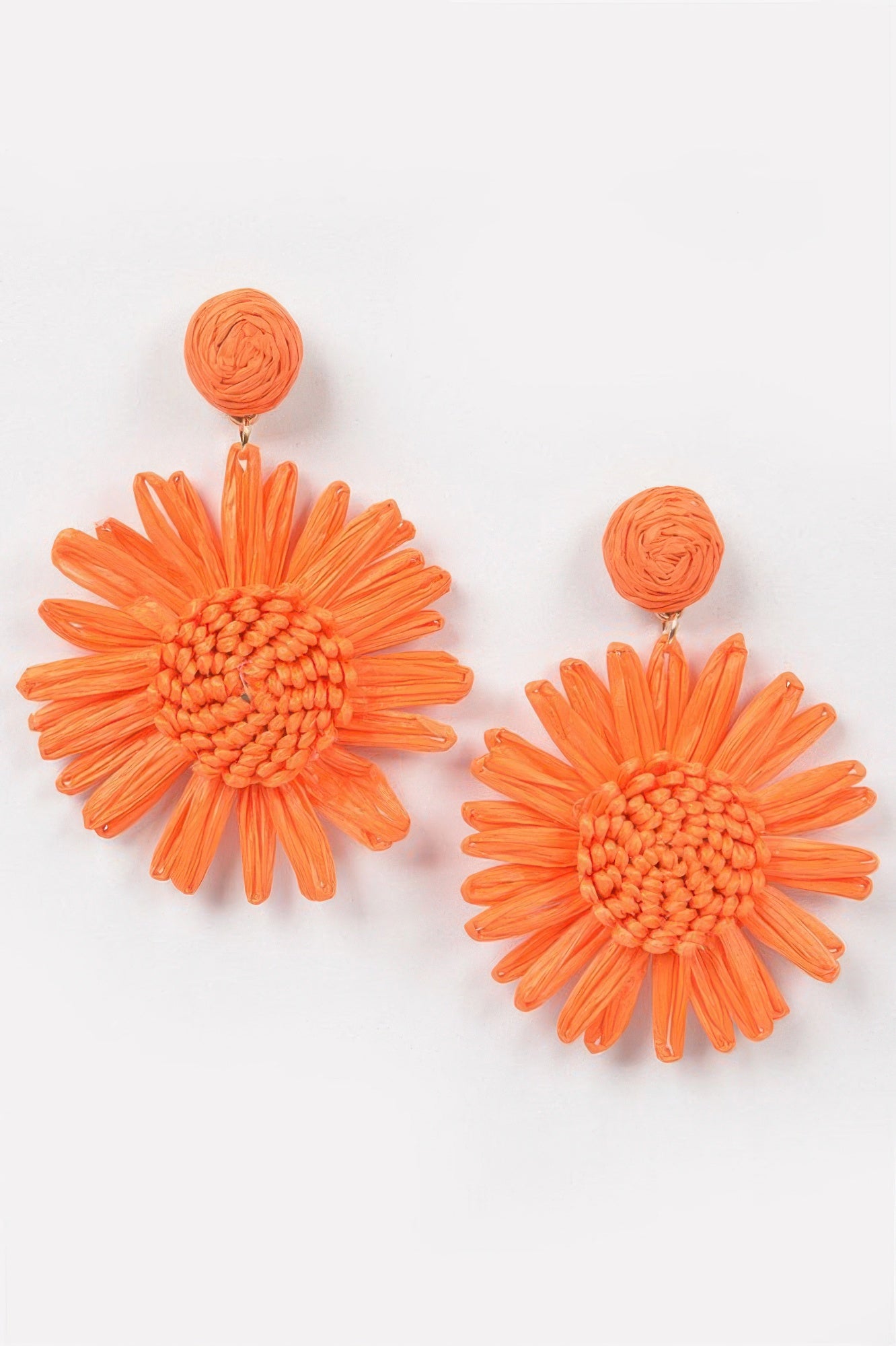 Orange flower earrings with woven round centers and layered petal strands
