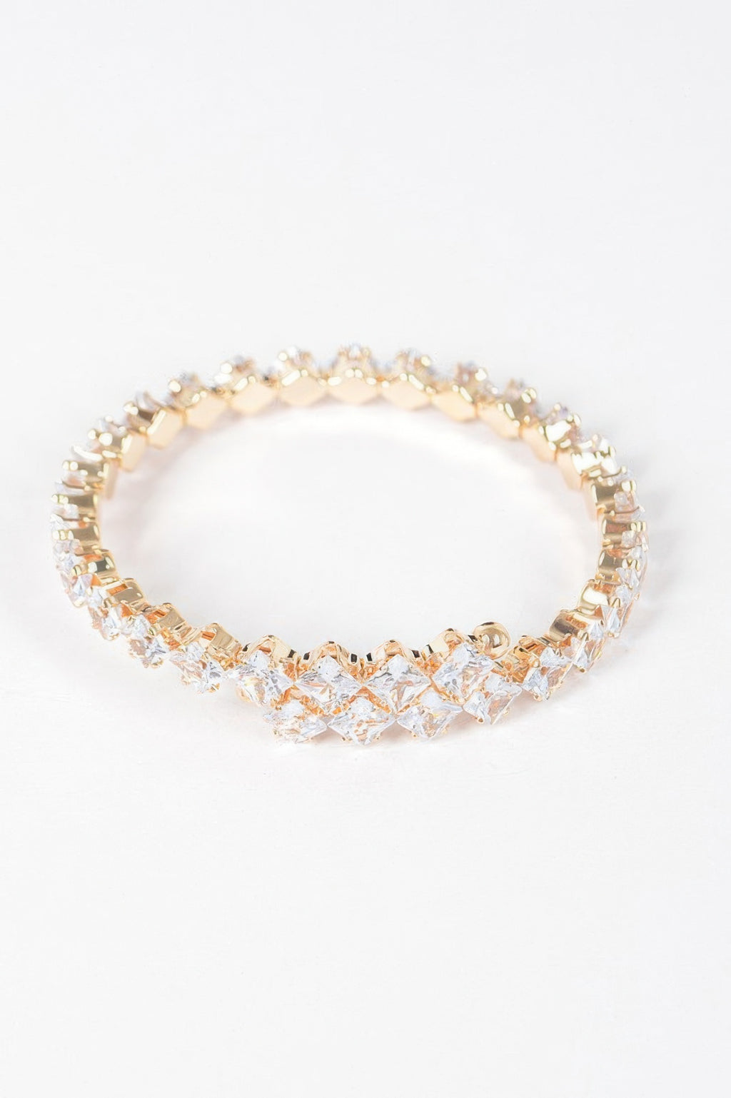 Cubic zirconia bracelet, round link row with clear stones and gold trim