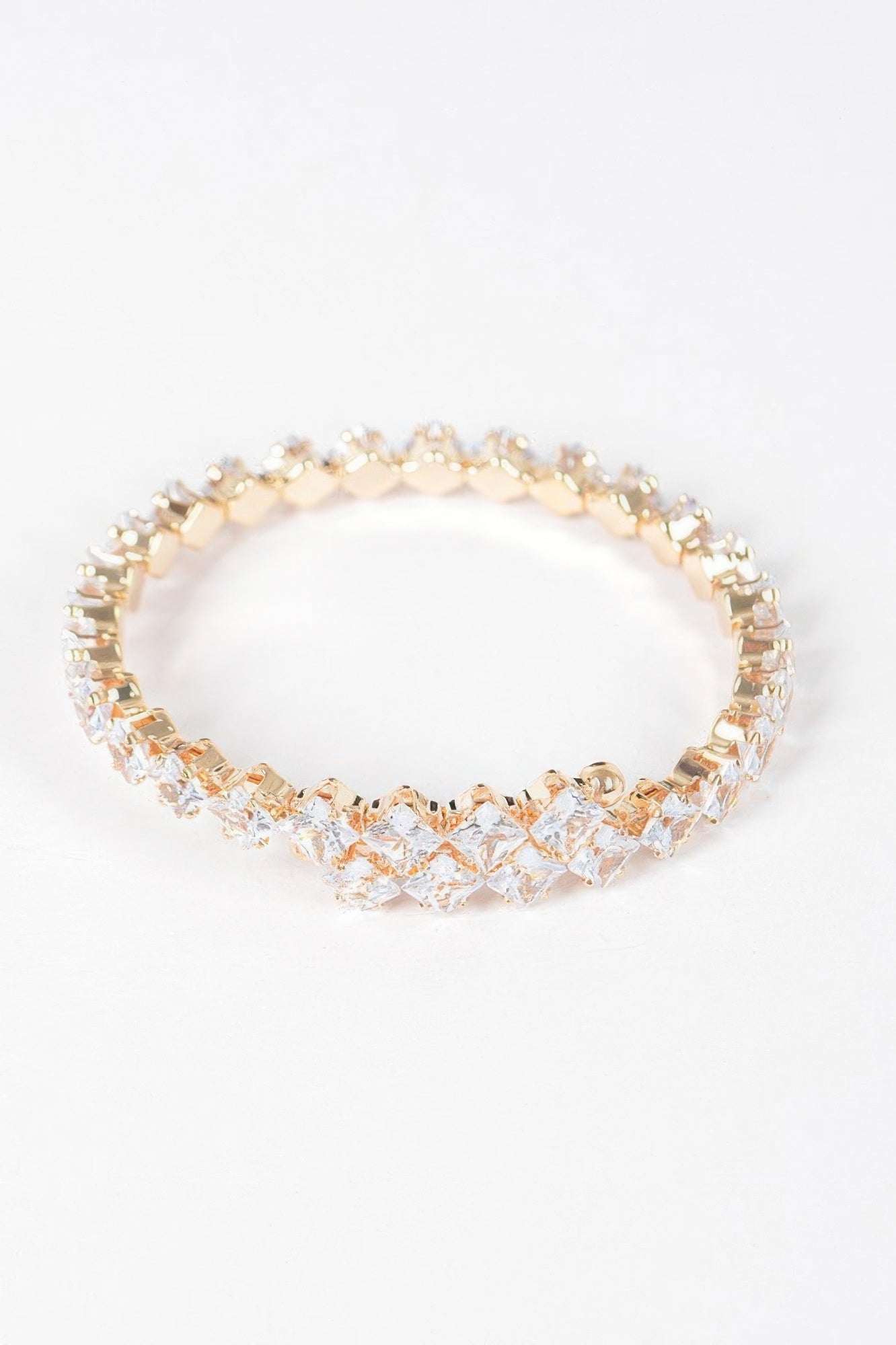 Cubic zirconia bracelet, round link row with clear stones and gold trim