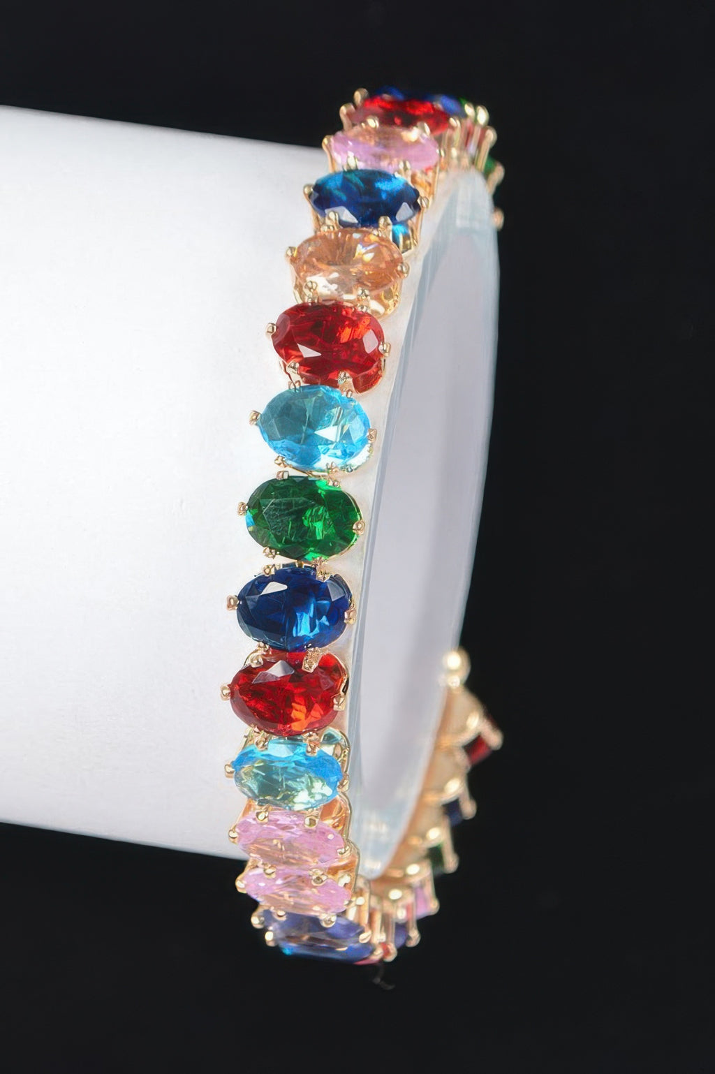 Colorful cubic zirconia bracelet with oval stones in red, blue, green, and gold-tone setting