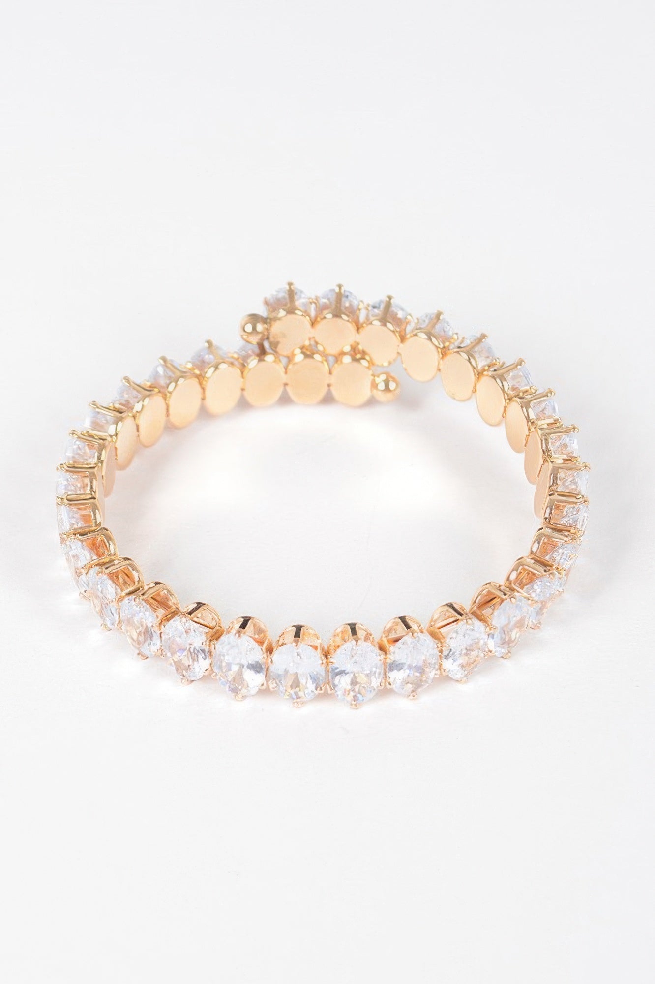 Clear cubic zirconia bracelet with clear oval stones in gold-tone prong setting