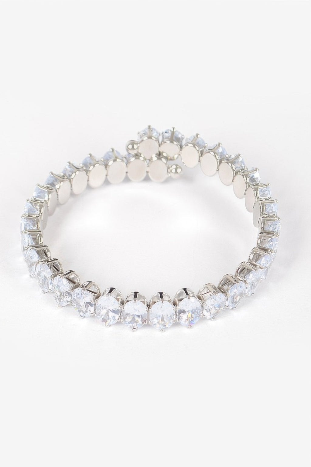 Clear cubic zirconia bracelet with oval stones and round bead-like links in gold-tone frame