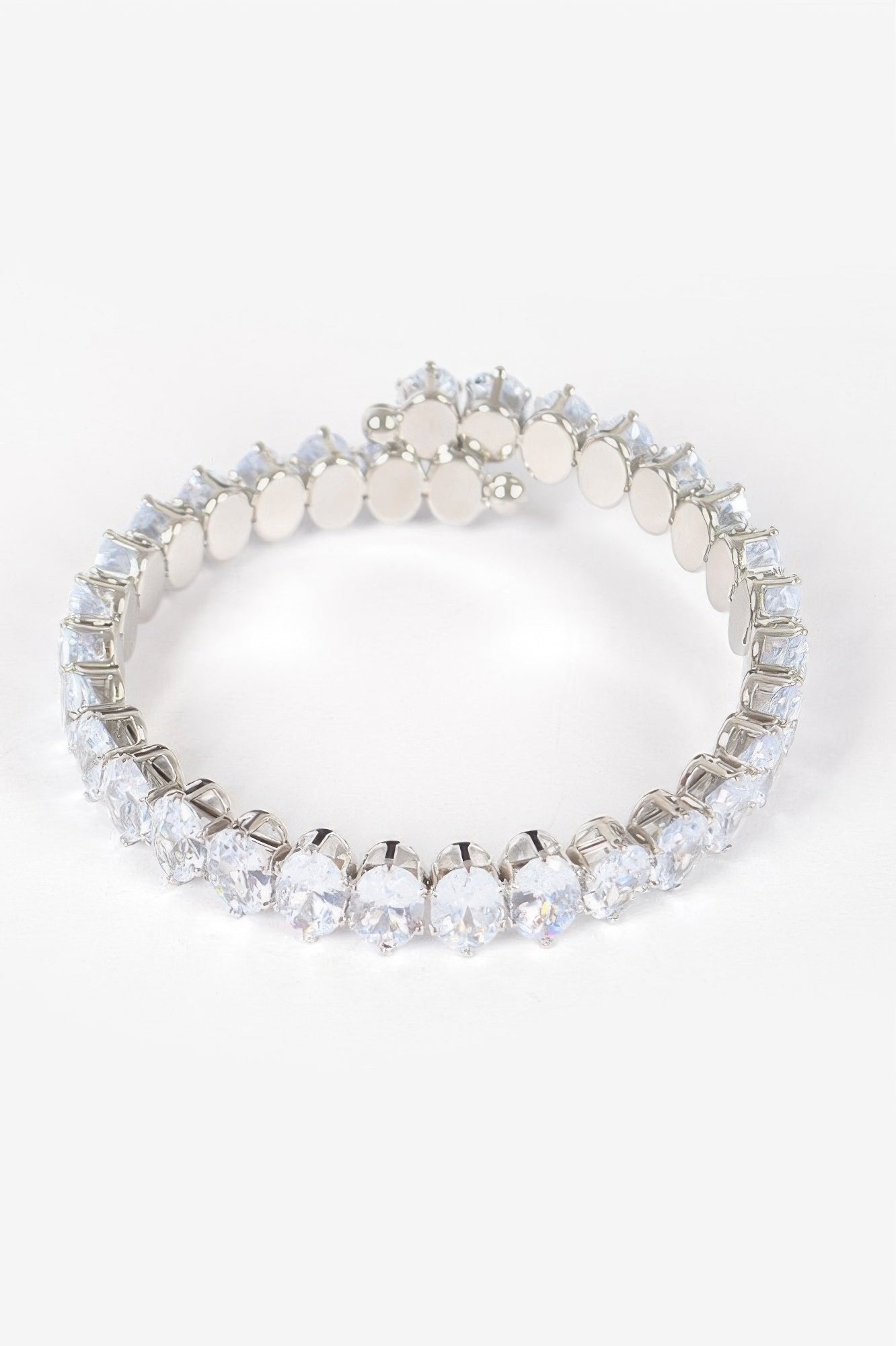 Clear cubic zirconia bracelet with oval stones and round bead-like links in gold-tone frame