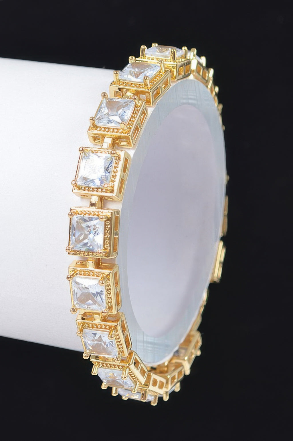 Cubic zirconia bracelet, gold-tone with clear square stones in a line