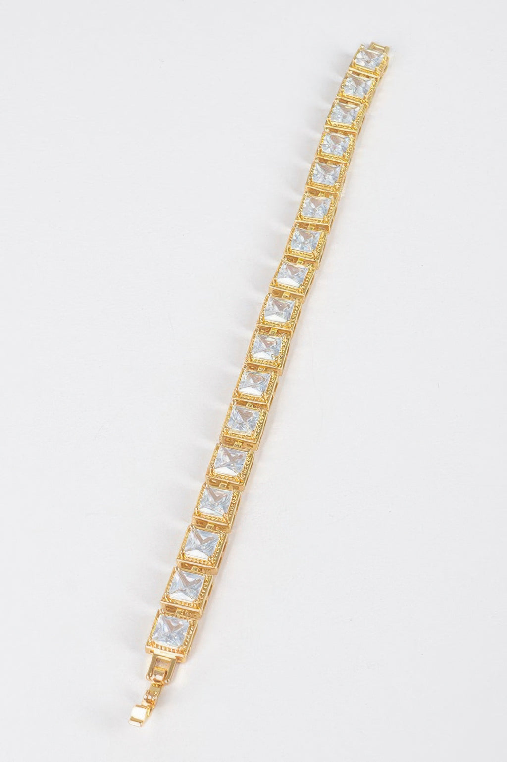 Gold-tone clear cubic zirconia bracelet with repeating square stones and clasp