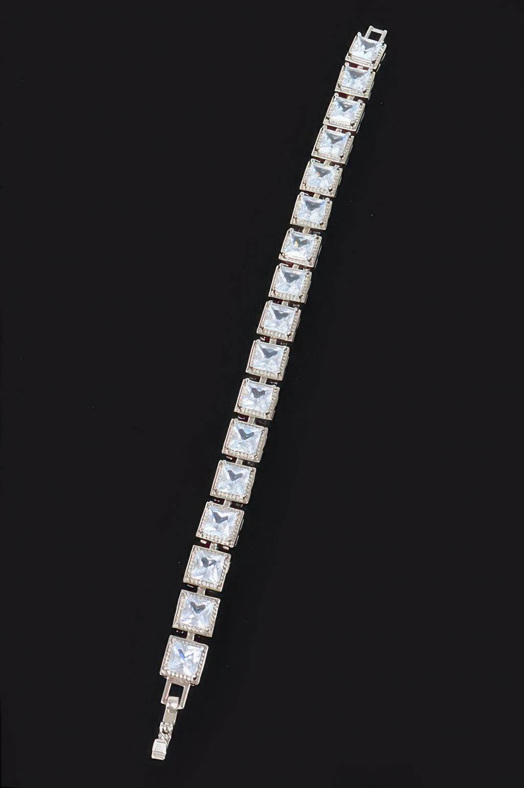 Silver-tone cubic zirconia bracelet with clear square stones in a straight row