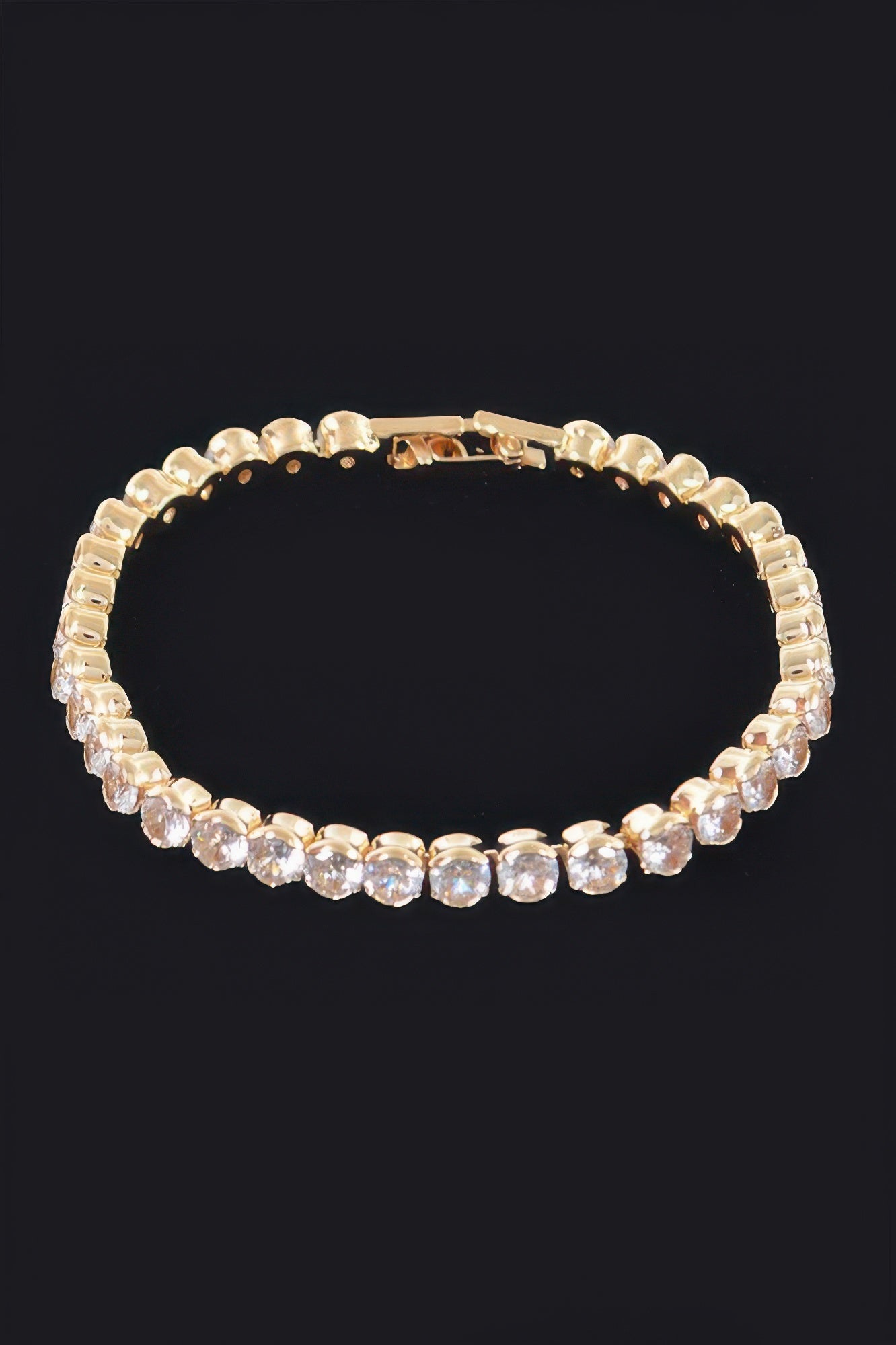 Cubic Zirconia Bracelet, gold-tone with clear round stones in a tennis style