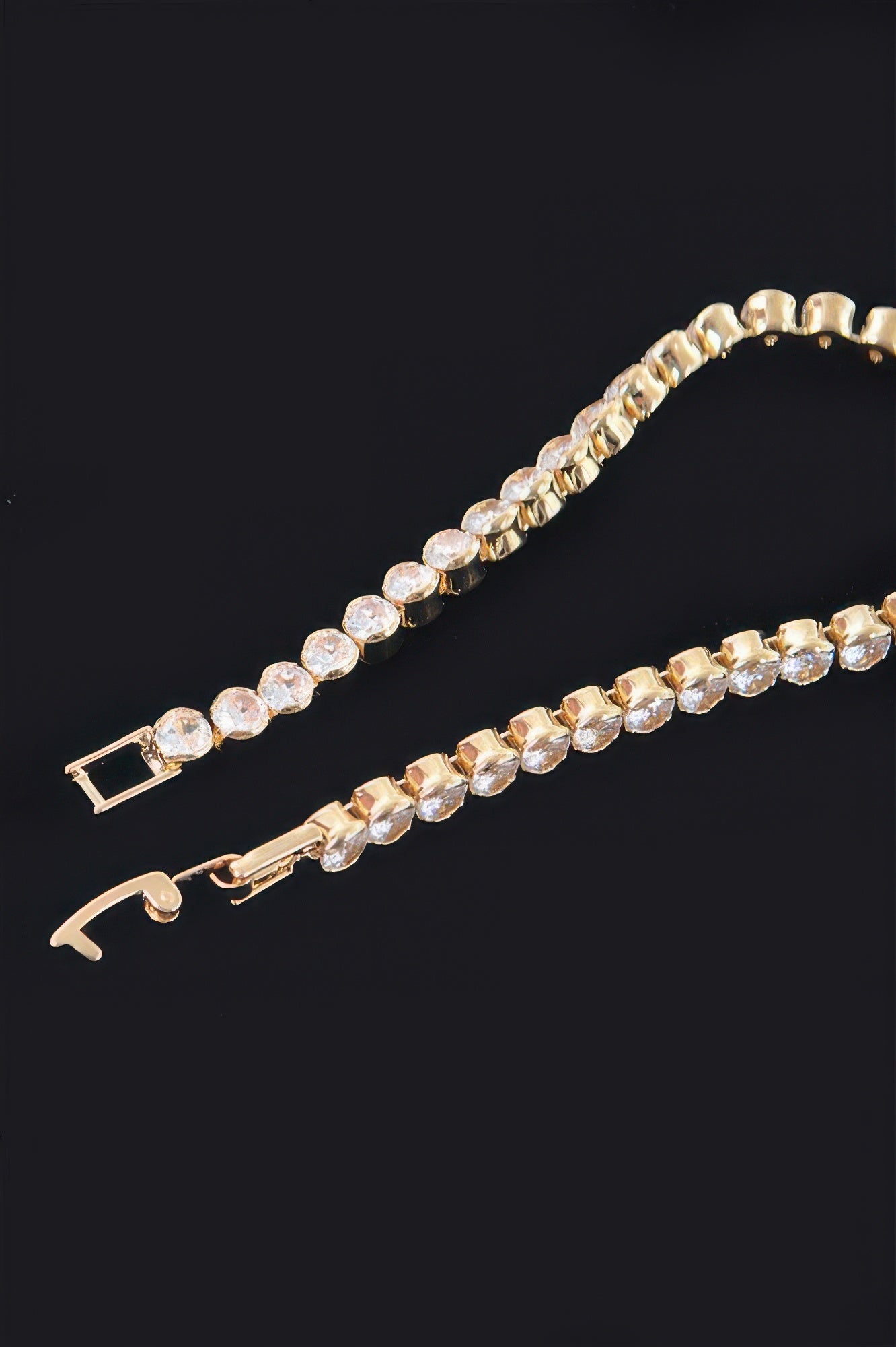 Cubic Zirconia tennis bracelet with gold-tone clasp and clear round stone links