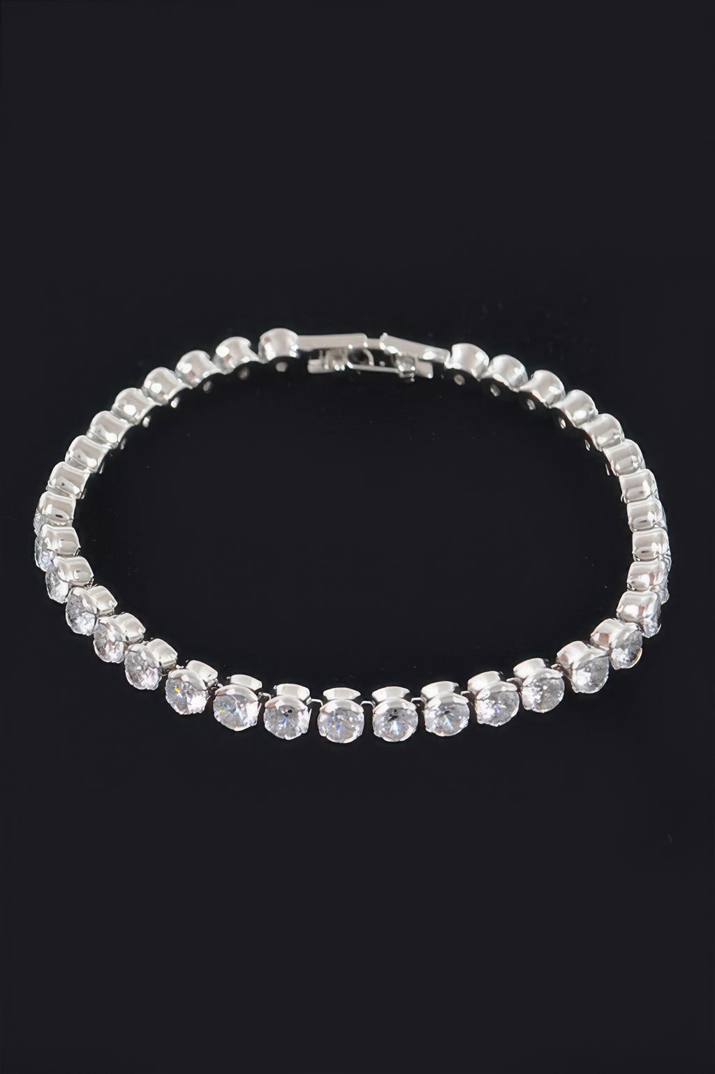 Cubic Zirconia Bracelet, silvertone with clear round stones and curved band