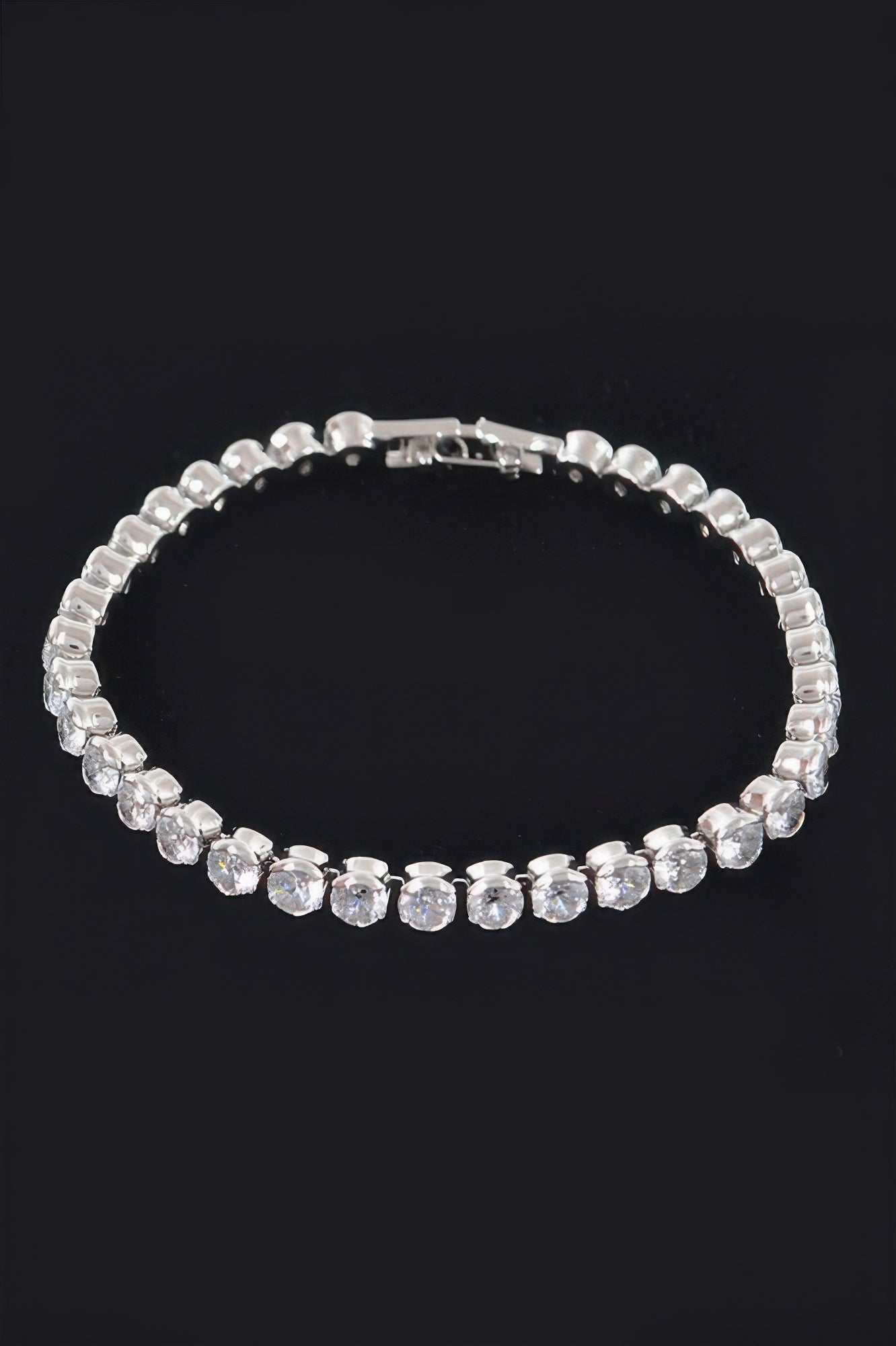 Cubic Zirconia Bracelet, silvertone with clear round stones and curved band