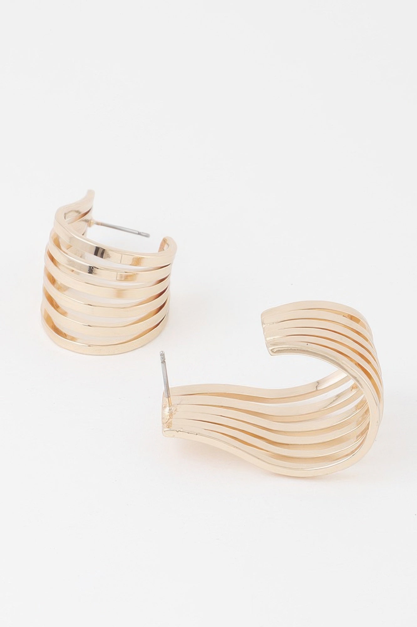 Open cage hoop earrings, gold tone, close-up showing open front cage