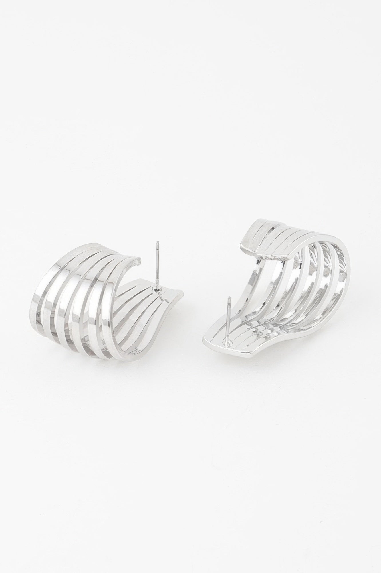 Open cage hoop earrings in silver tone with stacked bar cage hoops