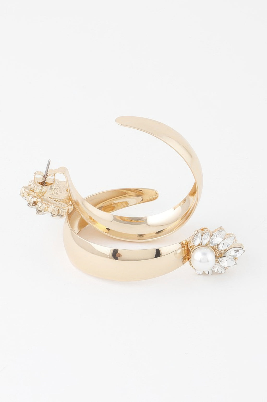 Gold-cream hoop earrings with pearl centerpiece and floral embellishment
