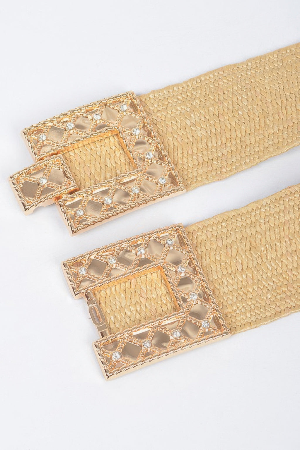 Beige rhinestone square buckle on stretch straw belt, close-up