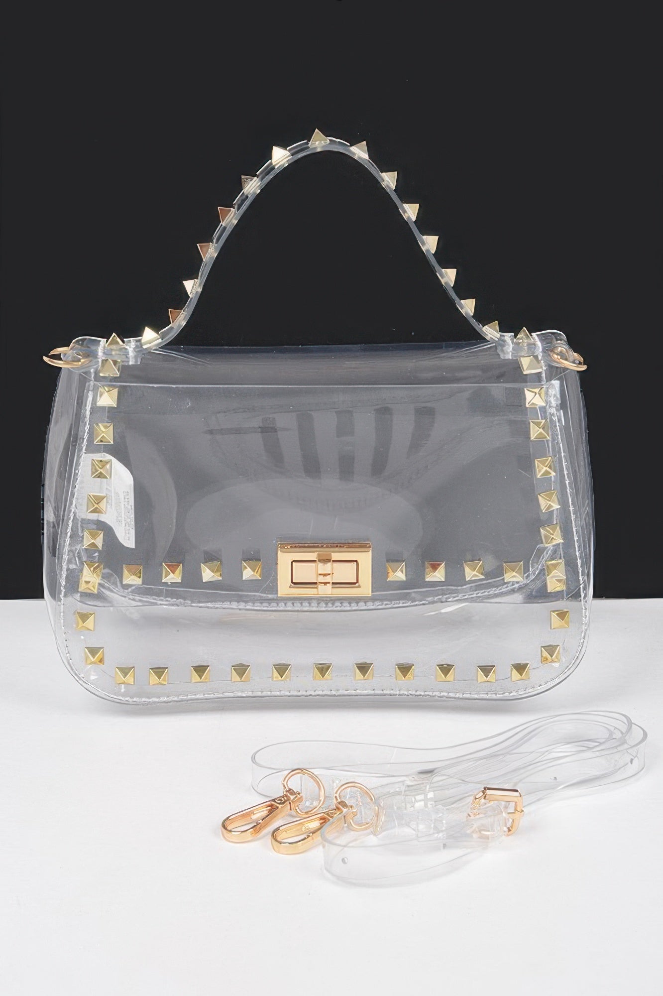 Transparent top-handle bag with gold studs and rectangular clasp