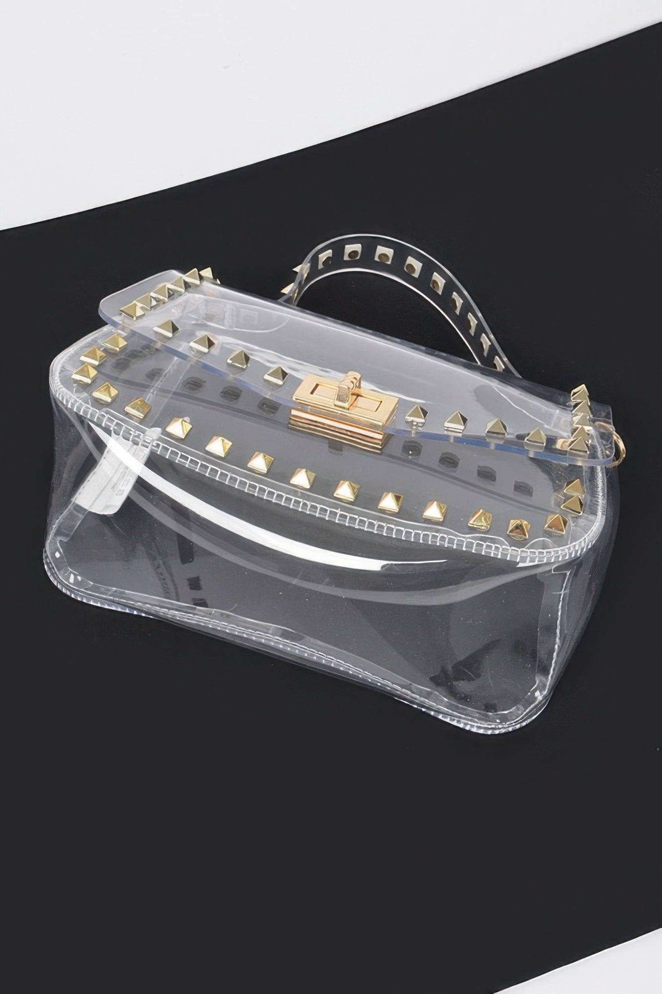 Transparent mini top-handle bag with gold studs and front buckle detail