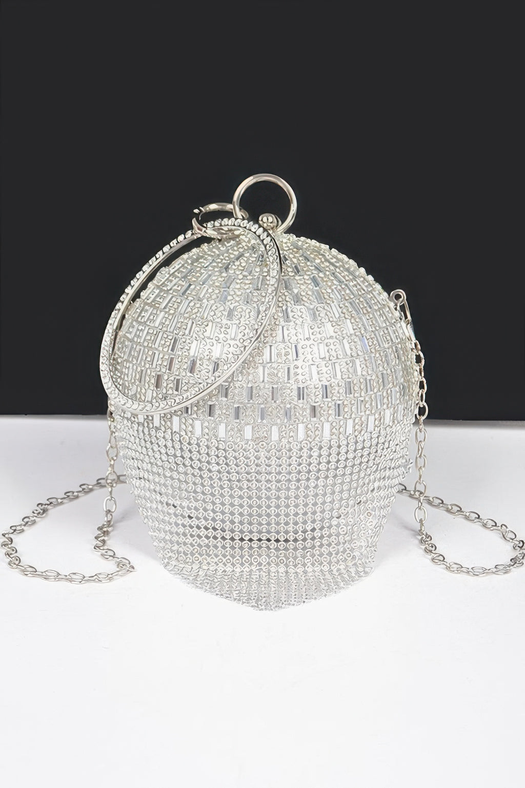 Silver rhinestone round ball clutch with top ring handle and chain strap