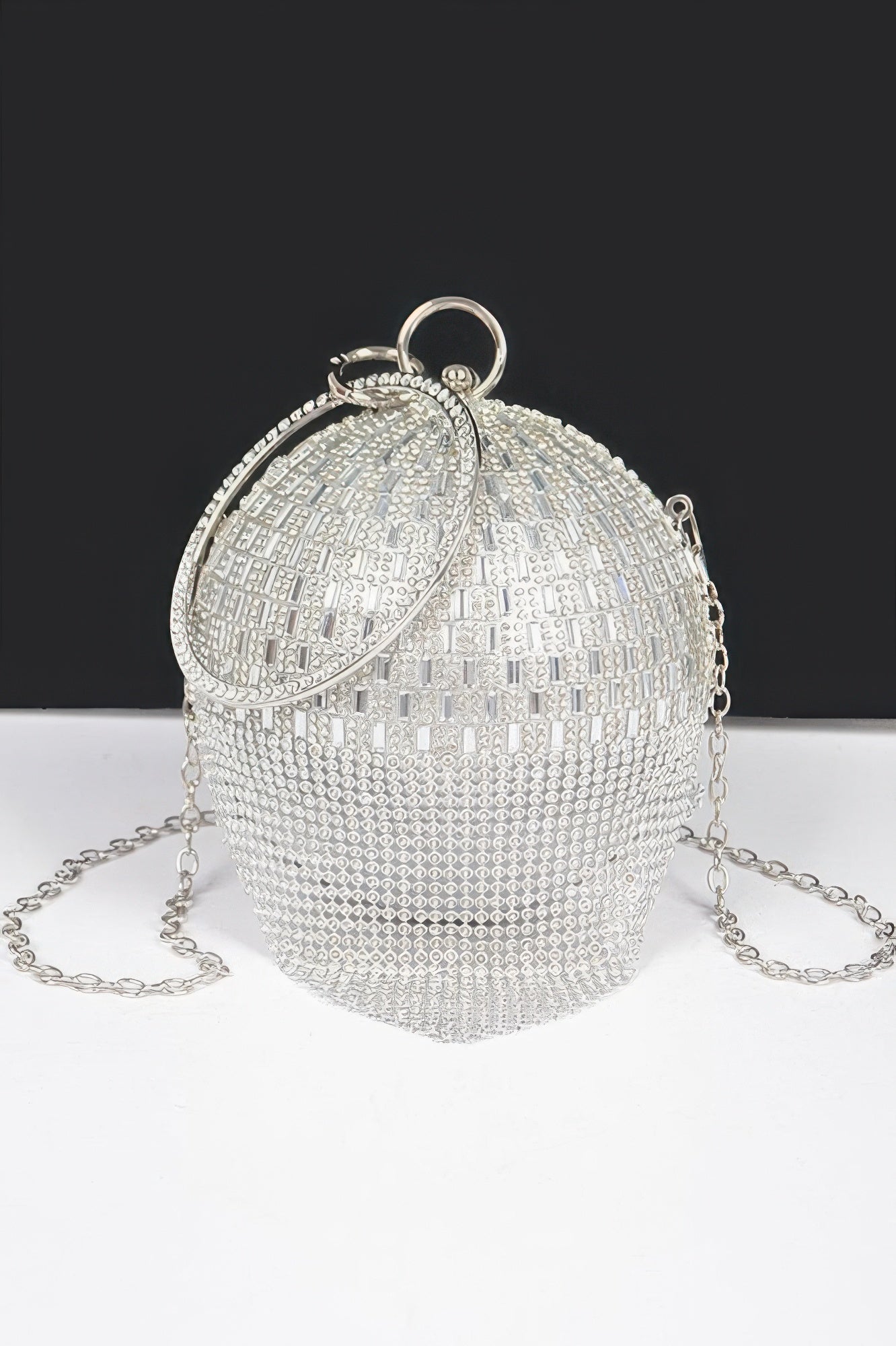 Silver rhinestone round ball clutch with top ring handle and chain strap