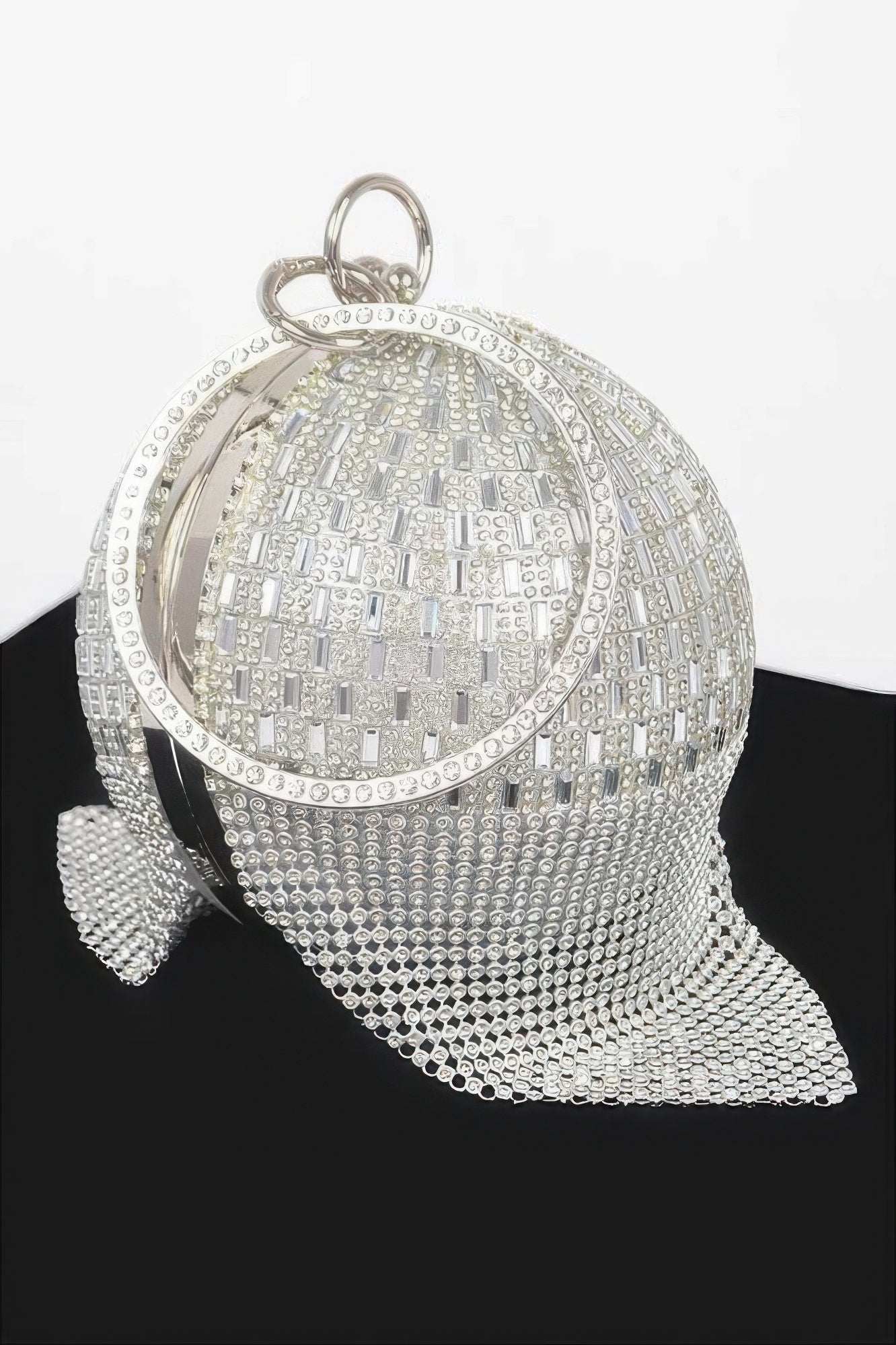 Silver rhinestone round ball clutch with chain strap and side dangle detail