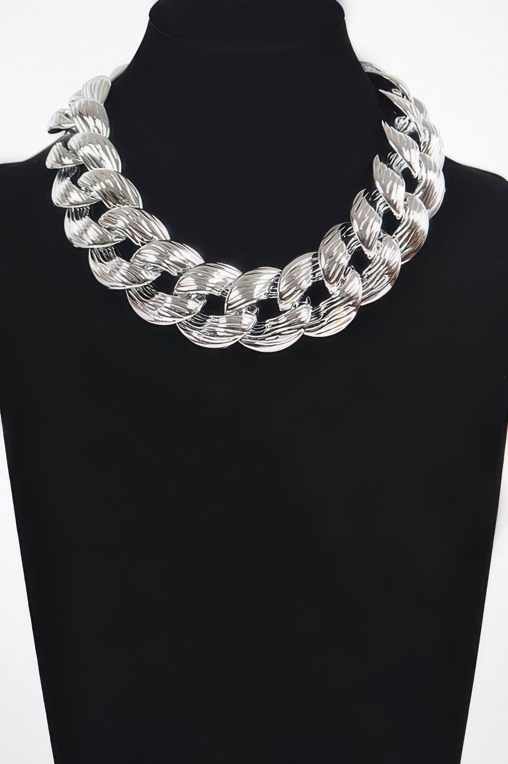 Oversized silver chain necklace with chunky interlocking oval links on bust