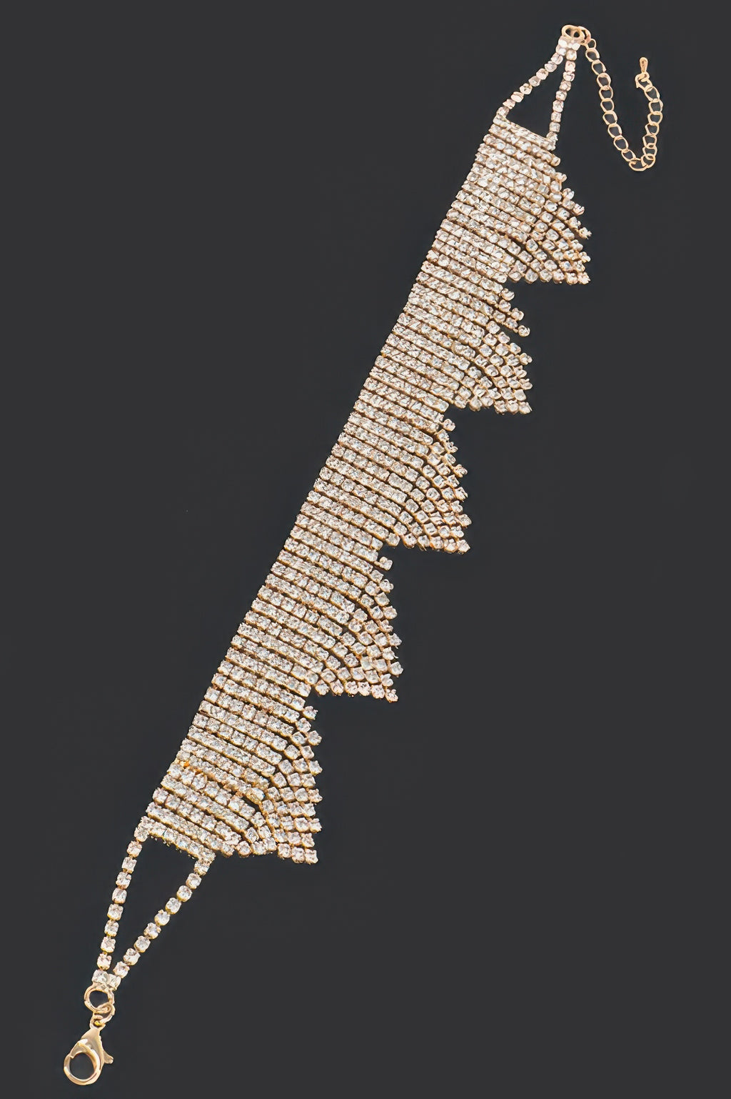 Gold-toned rhinestone draped choker with tiered fringe triangle drops