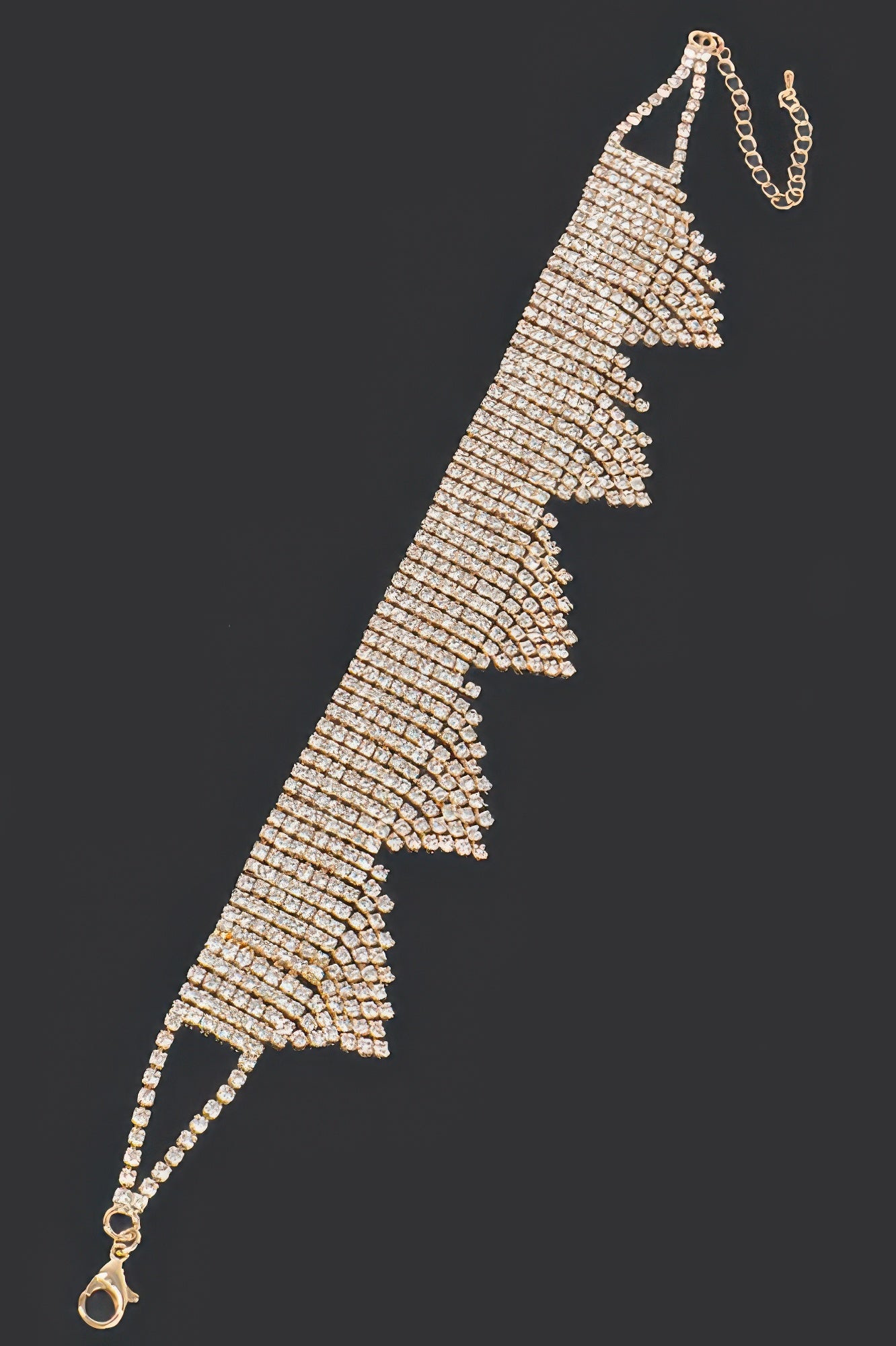 Gold-toned rhinestone draped choker with tiered fringe triangle drops