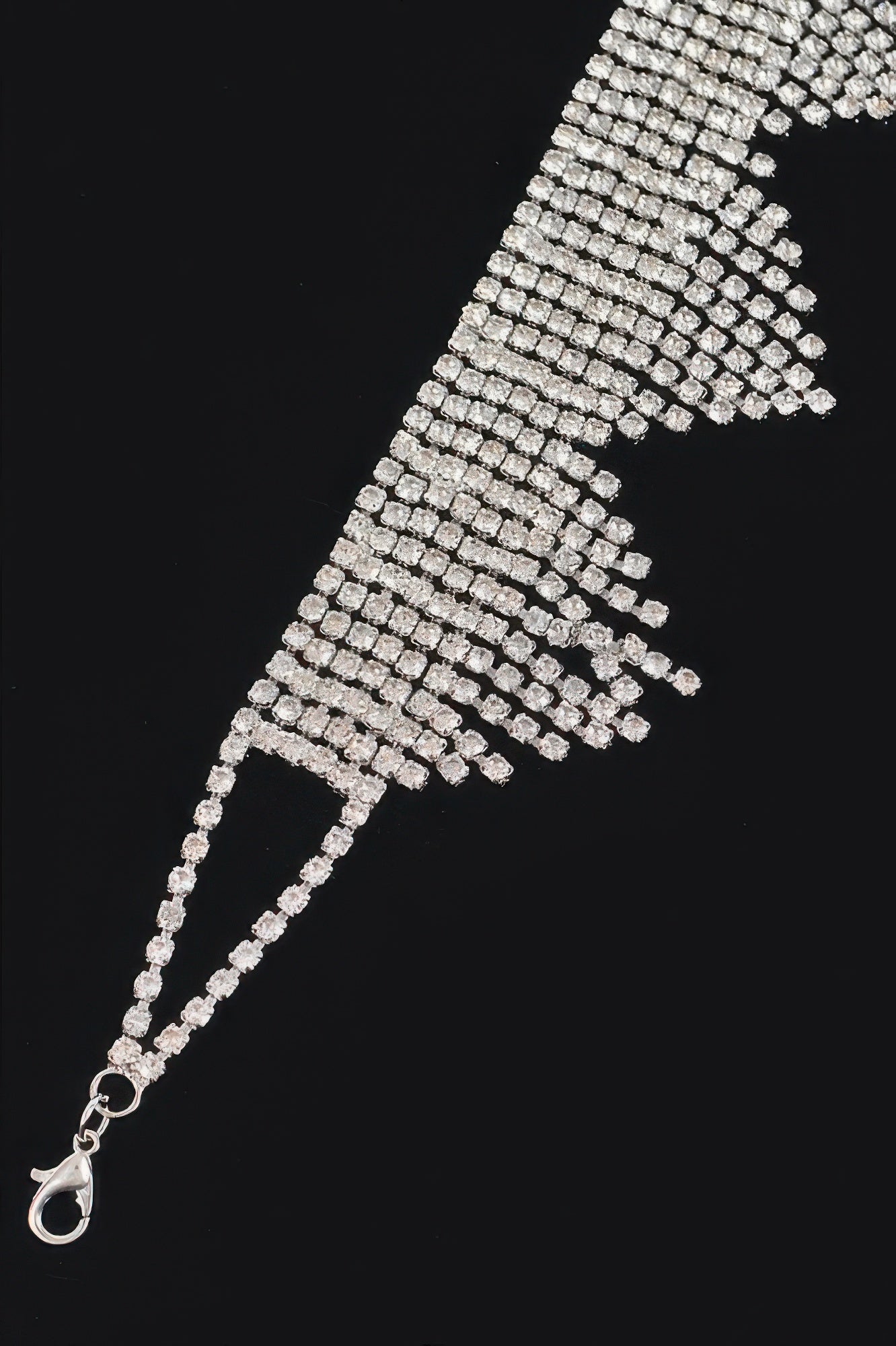 Silver rhinestone fringe drop row detail with oval clasp and extender chain