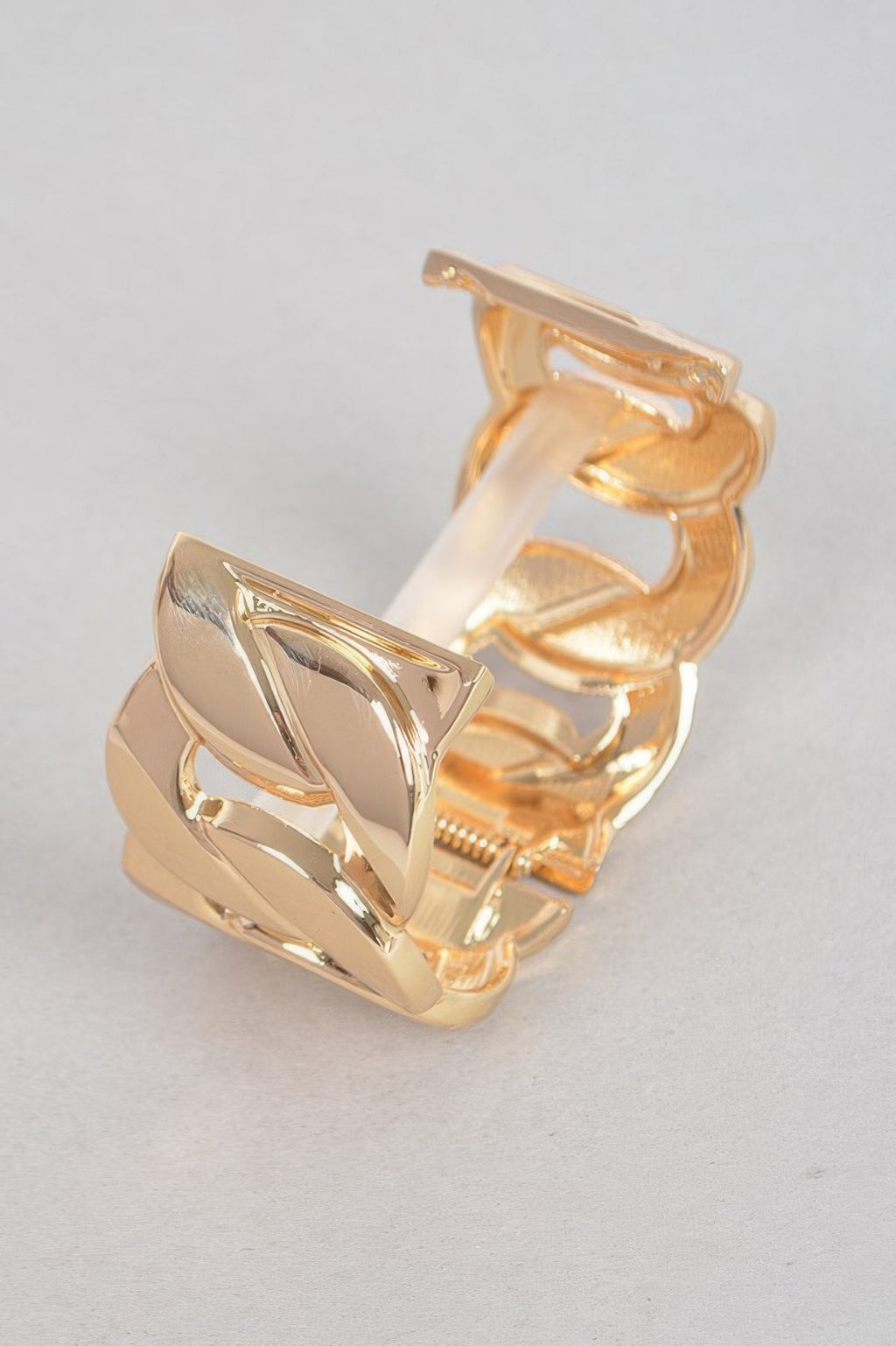 Gold wide chain cuff bracelet with sculpted, reflective links and small bar detail
