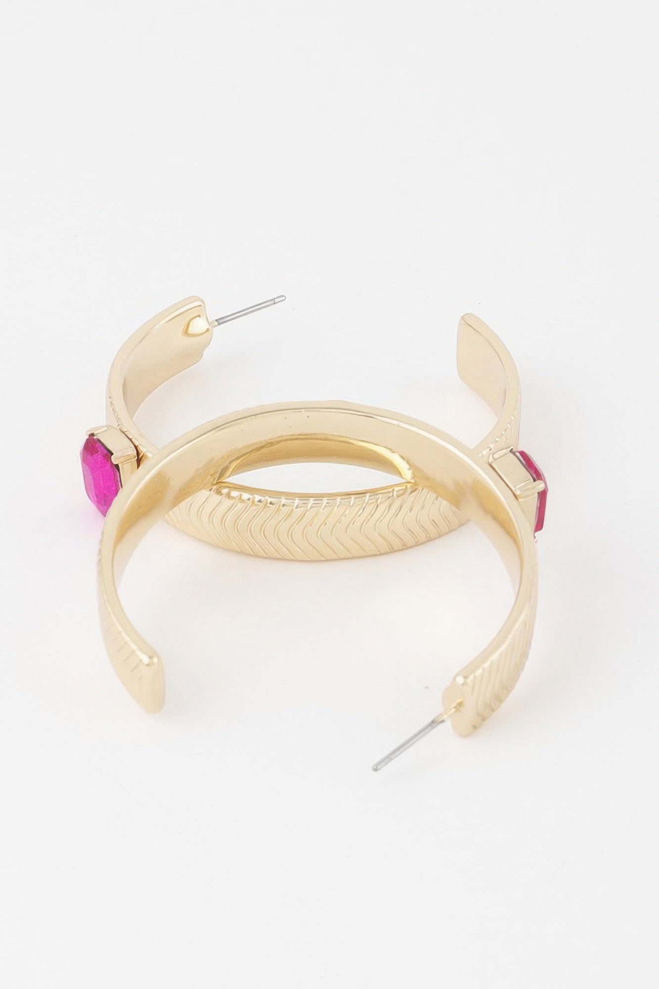 Gold hoop earrings with textured finish and pink rhinestone square accents
