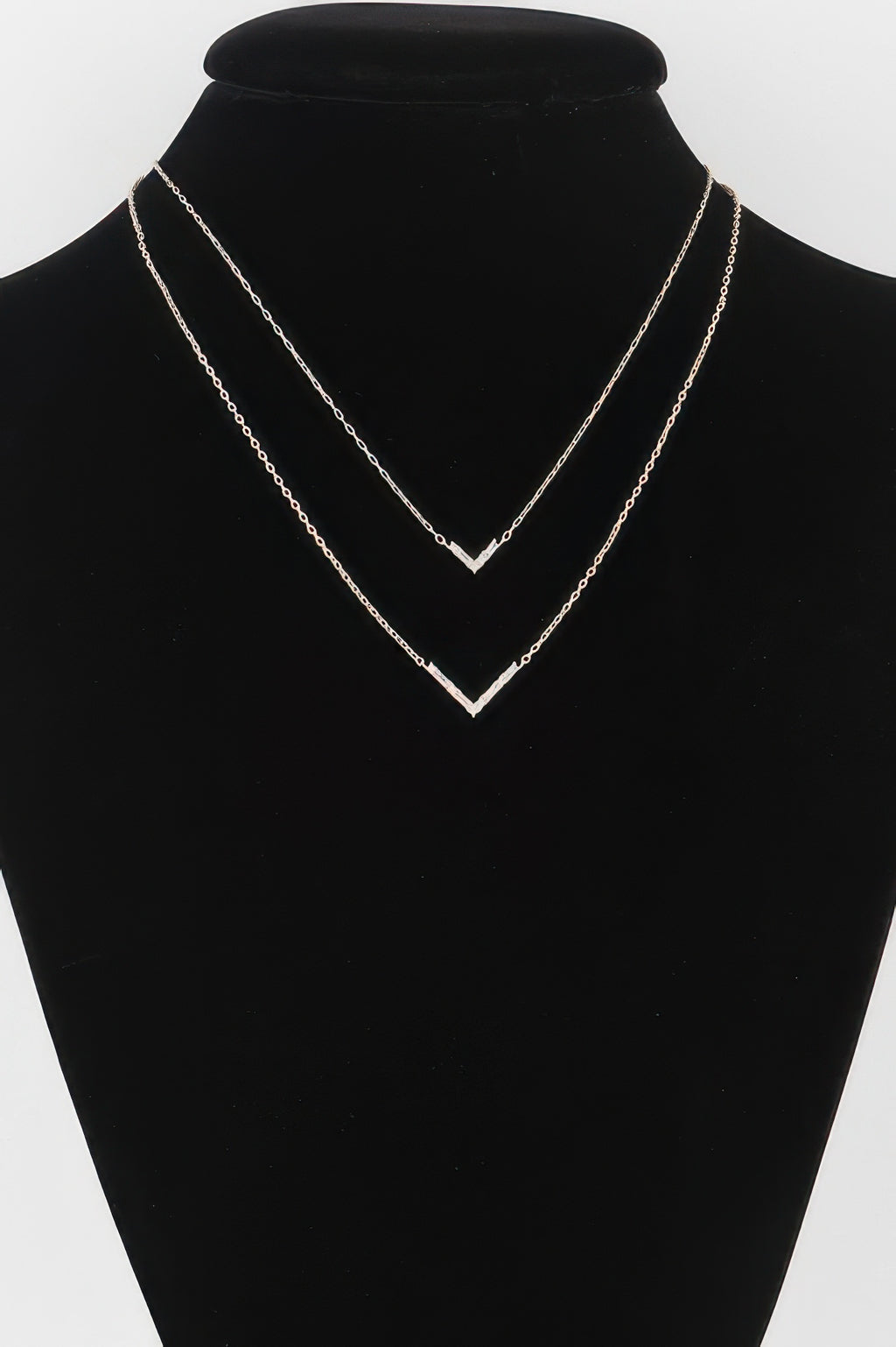 Double Crystal V necklace with two layered V crystal charms, gold-tone chains