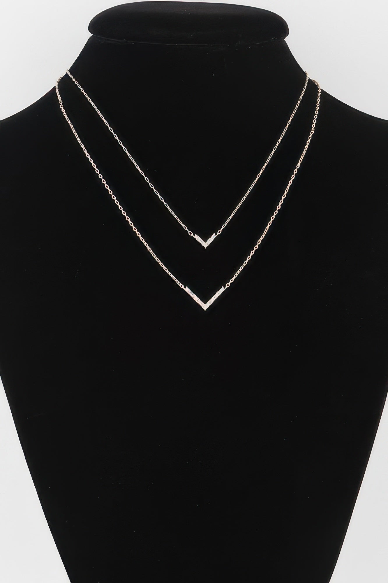 Double Crystal V necklace with two layered V crystal charms, gold-tone chains