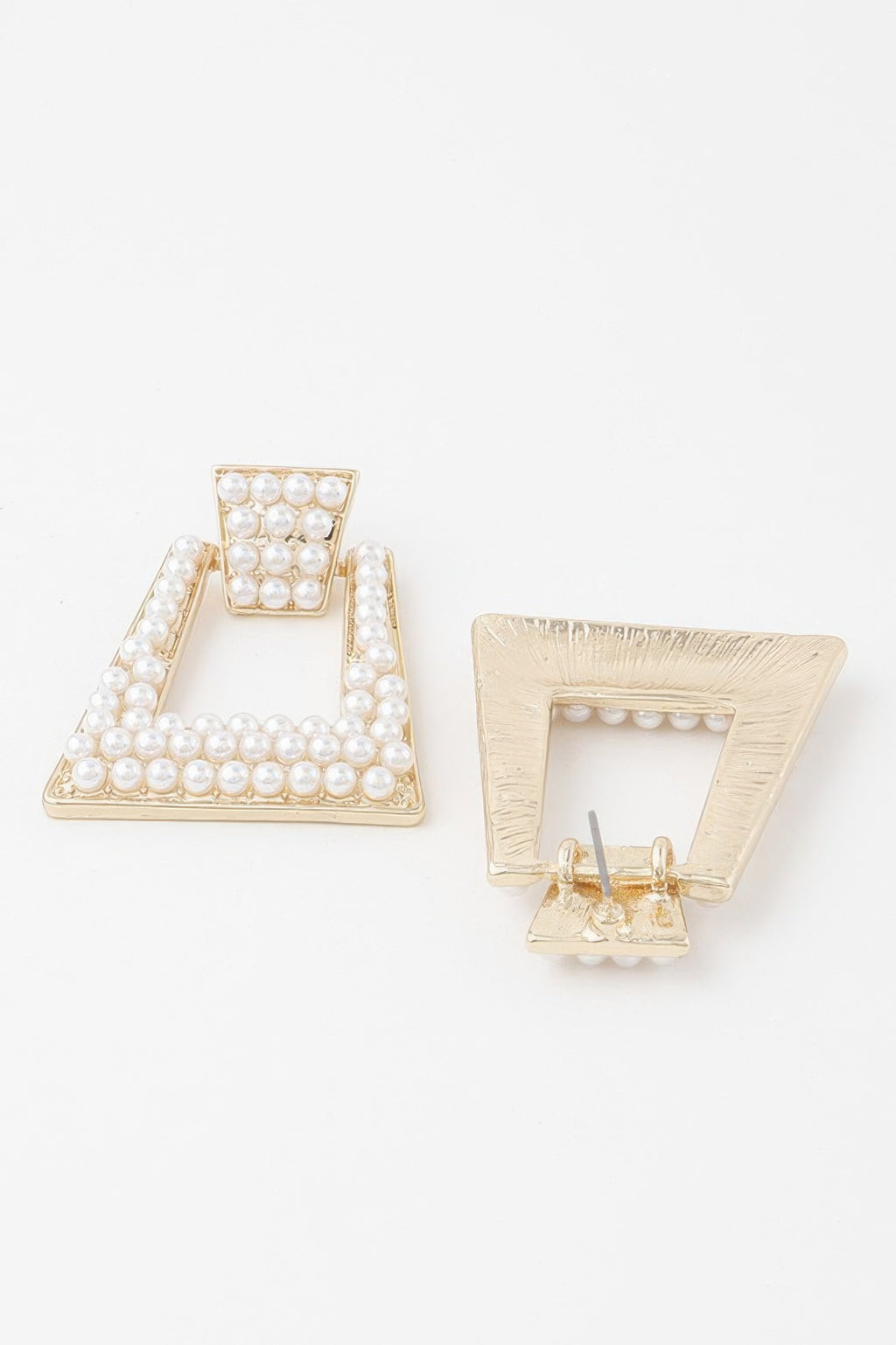 A-shaped rhinestone and pearl earrings; one earring back with pin shown