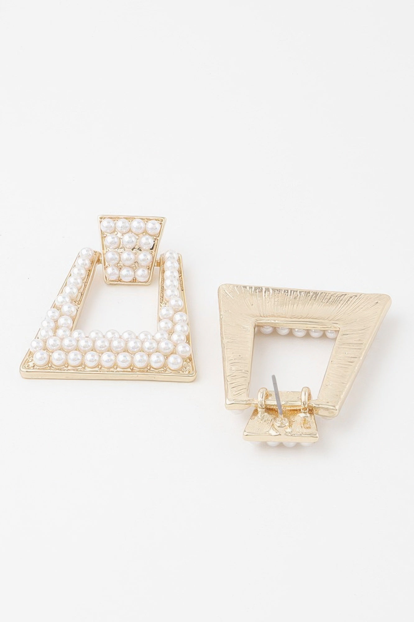A-shaped rhinestone and pearl earrings; one earring back with pin shown